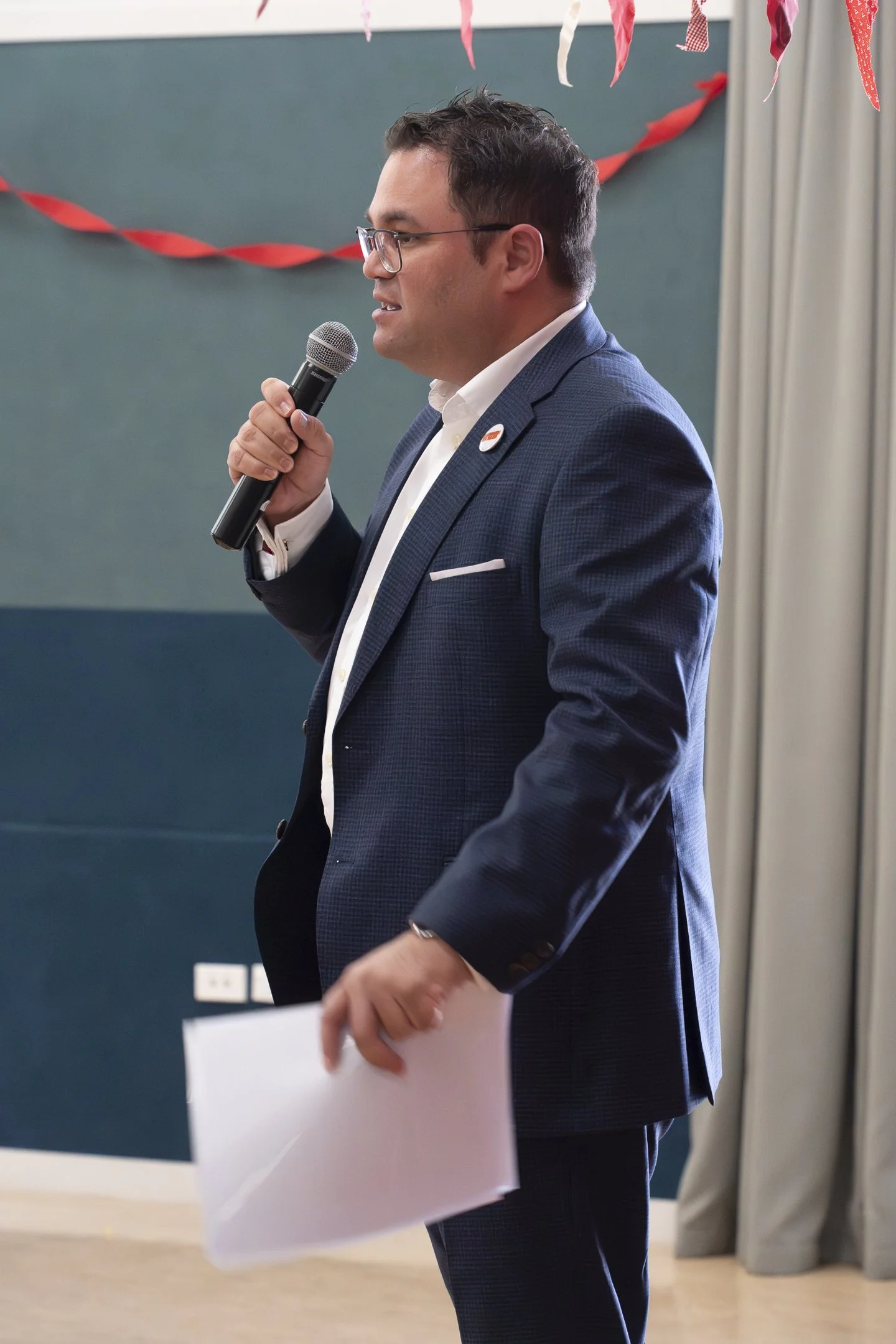An example of Event Photography of Tangi Utikere speaking into a microphone at his Palmerston North Labour Campaign Launch