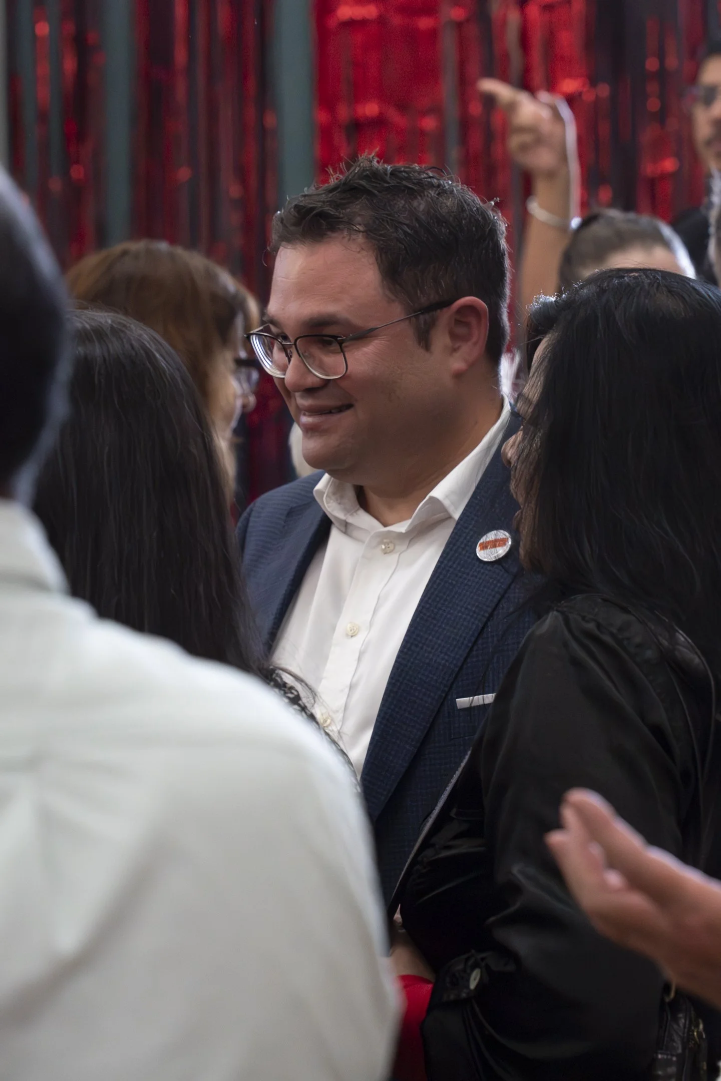 An example of Event Photography of Tangi Utikere chatting in a crowd at his Palmerston North Labour Campaign Launch