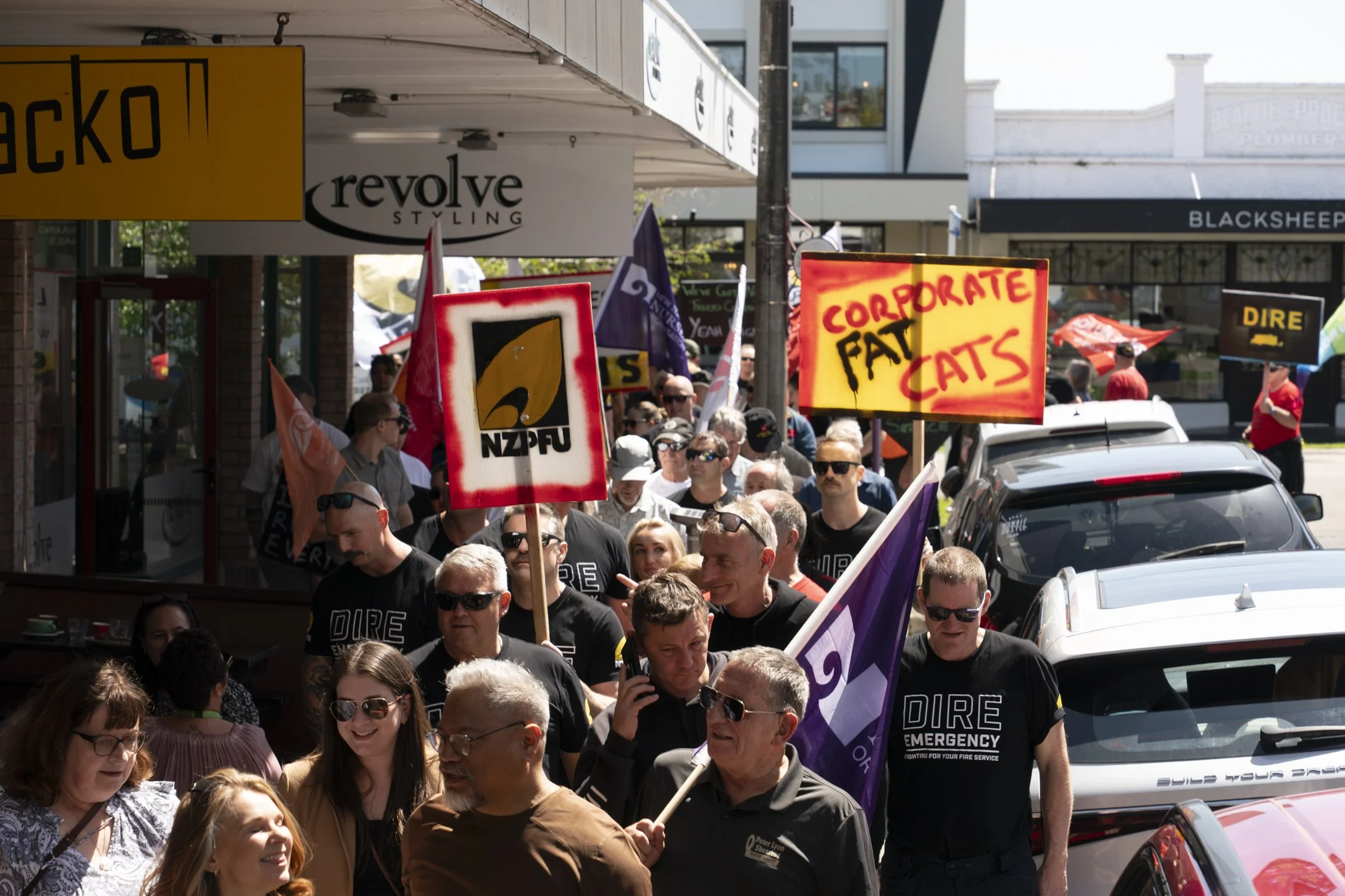 An example of Documentary Photography of protesters marching in the streets with signs in Palmerston North
