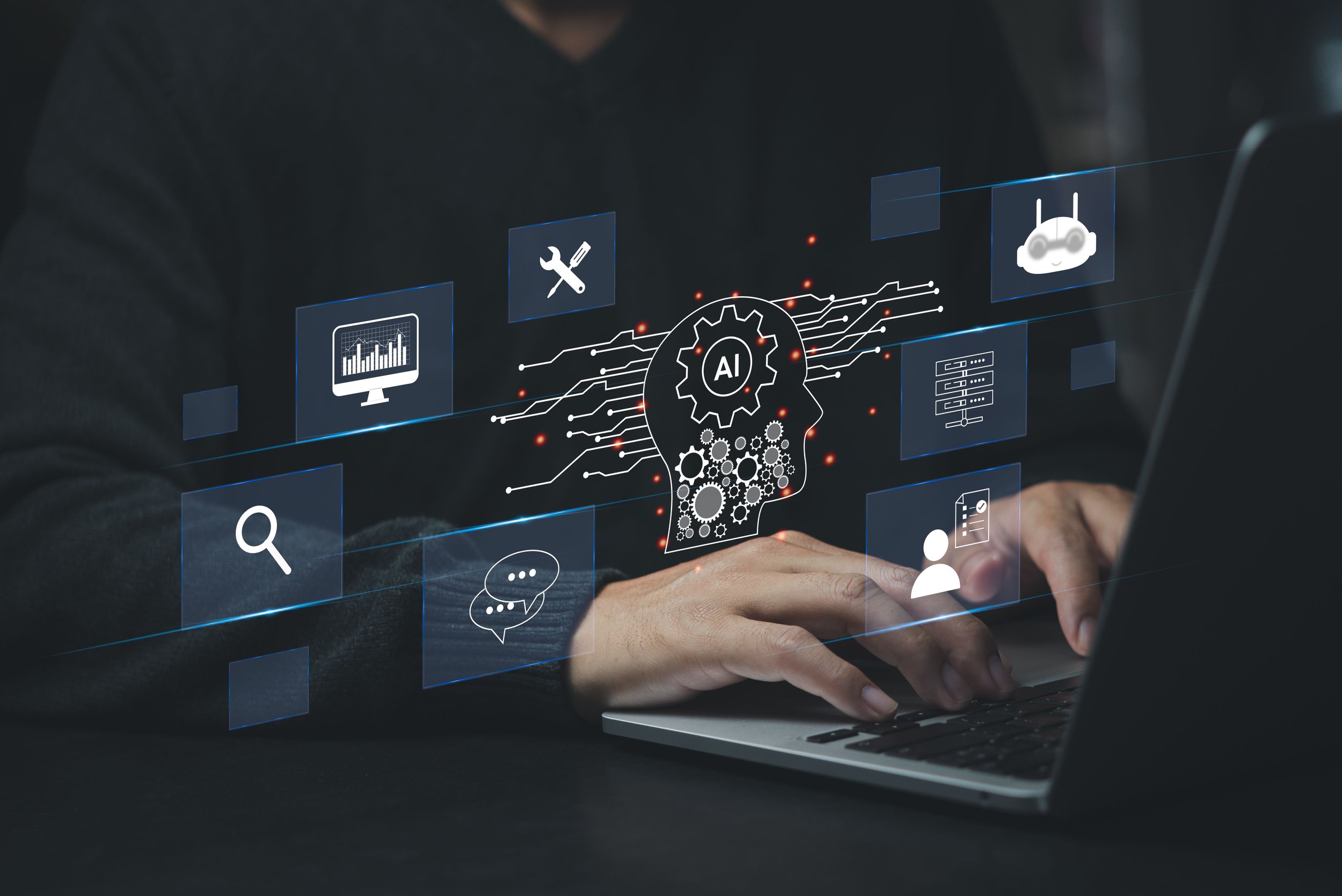 A person using a laptop with a digital graphic overlay related to artificial intelligence and technology, including icons of a magnifying glass, bar chart, tools, robot, chat bubble, and user profile.