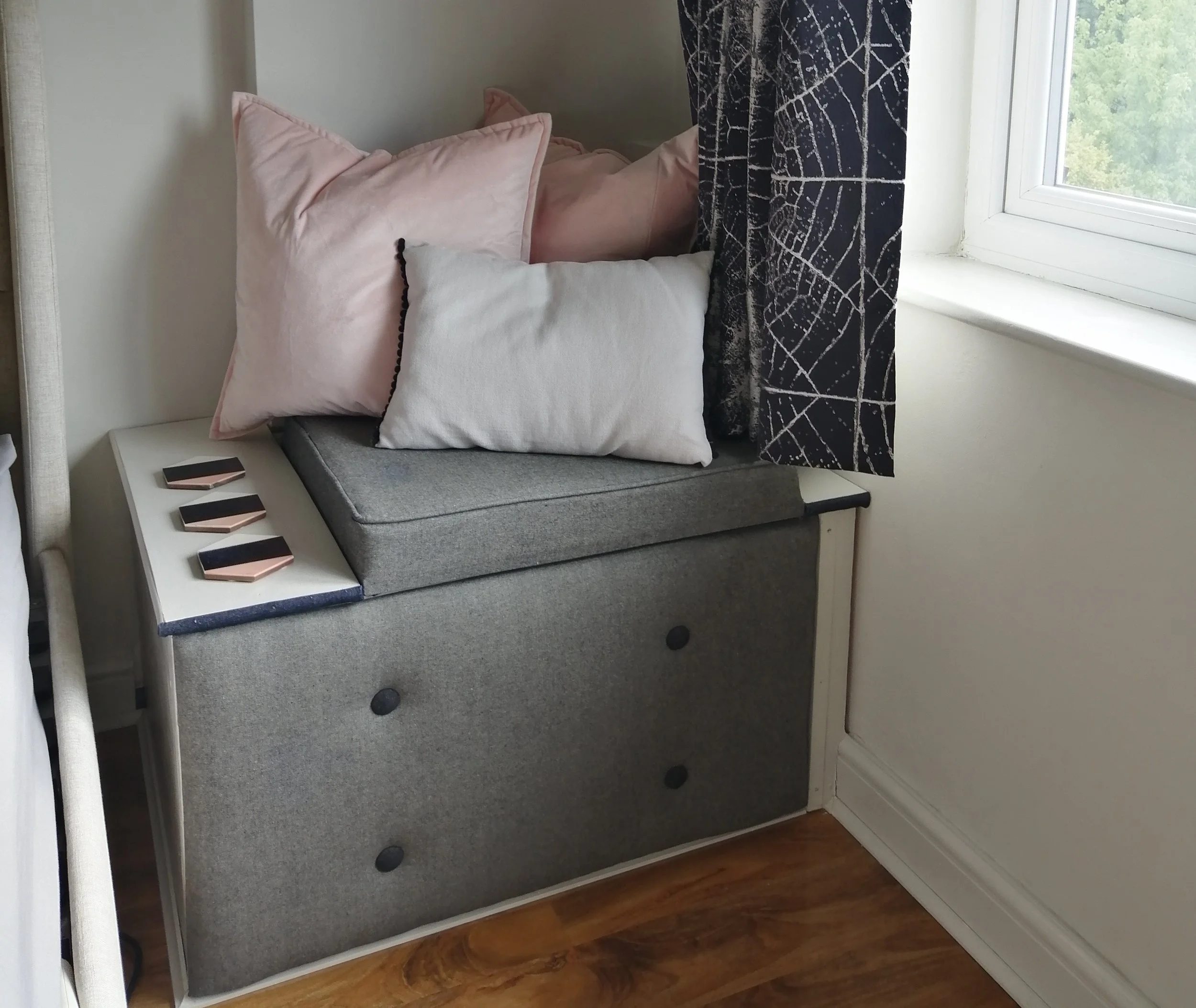 bespoke bedroom window seat with grey upholstery