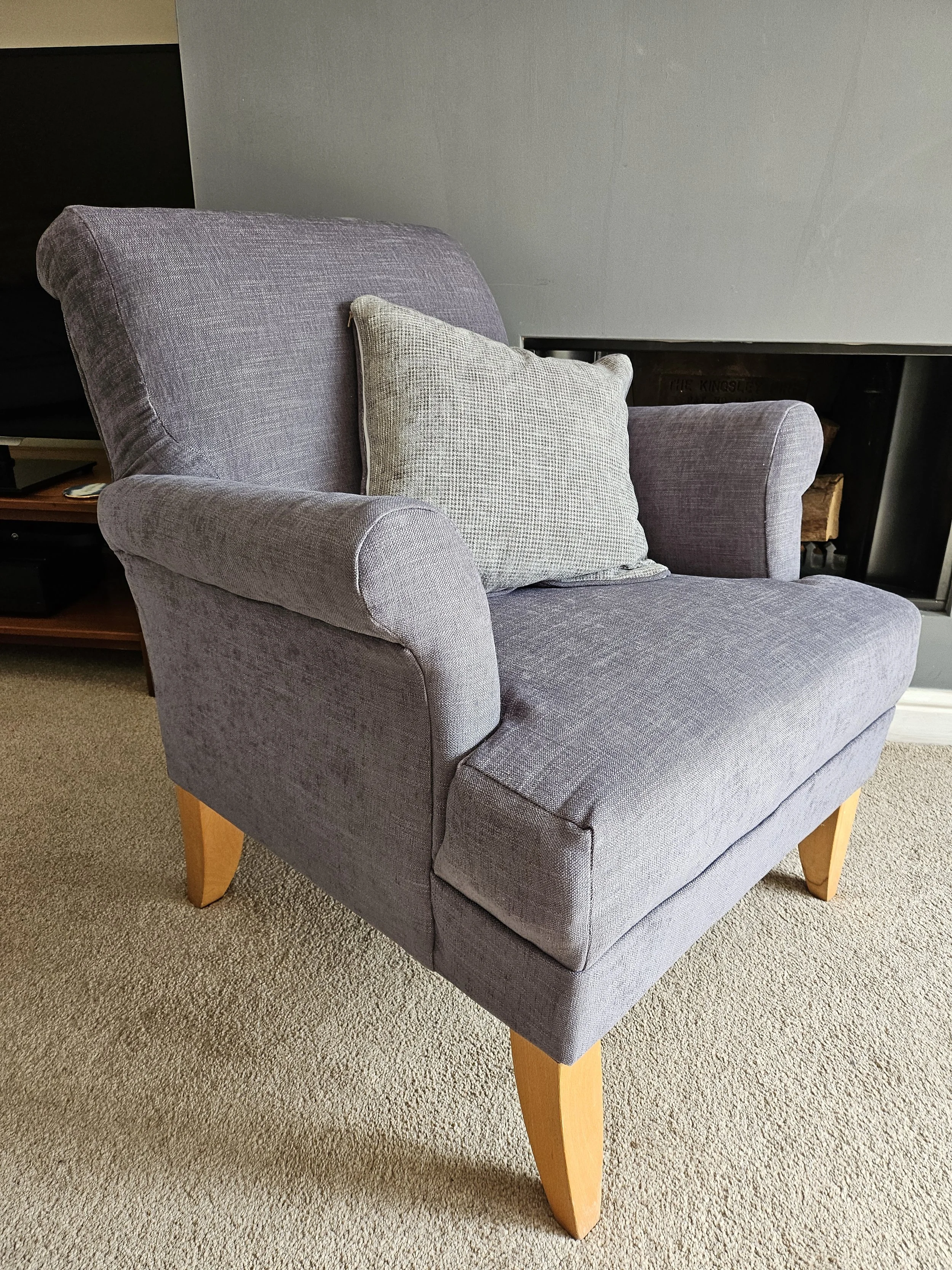 Grey armchair with grey cushion