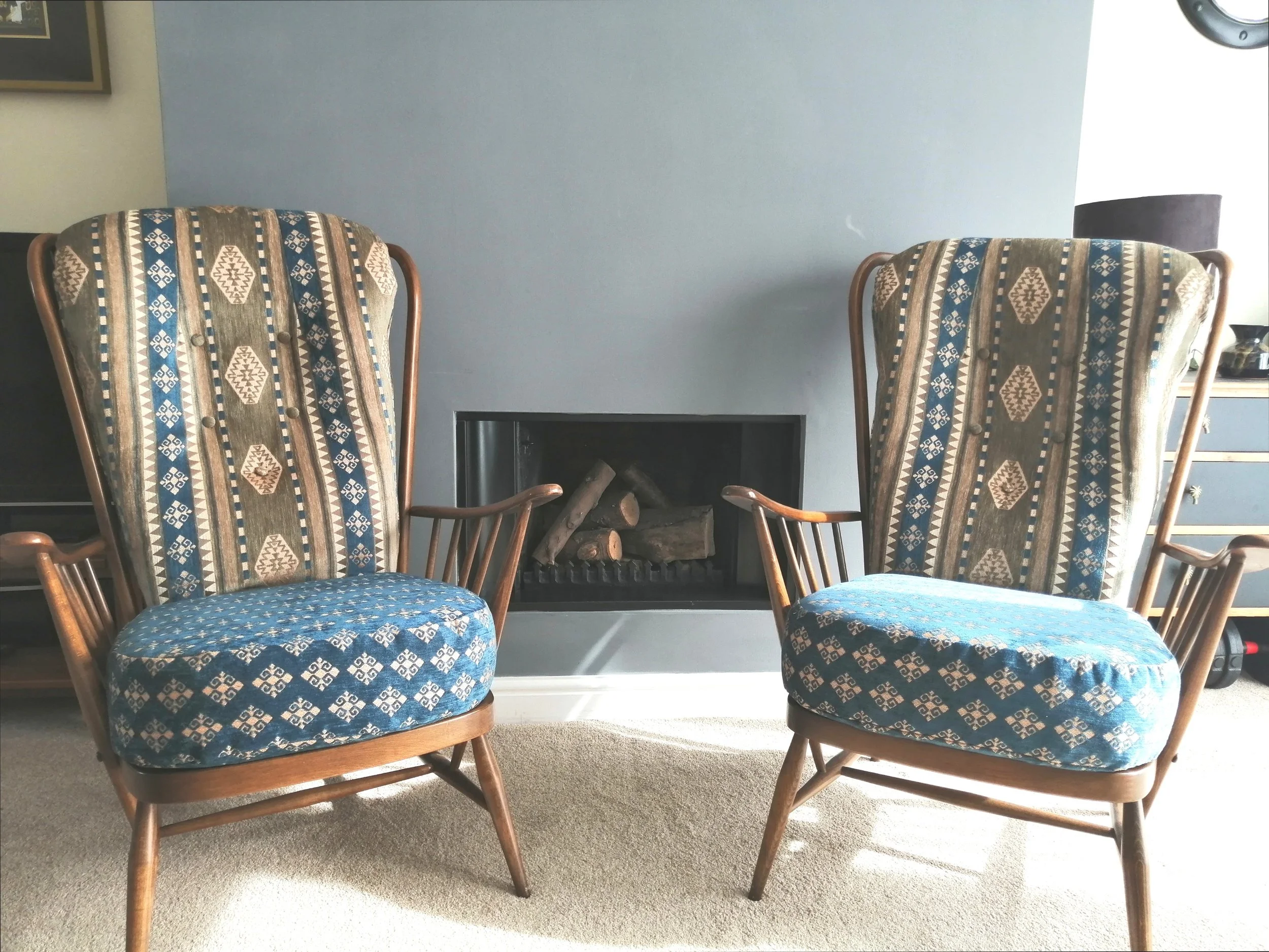 Ercol armchairs in patterned fabric