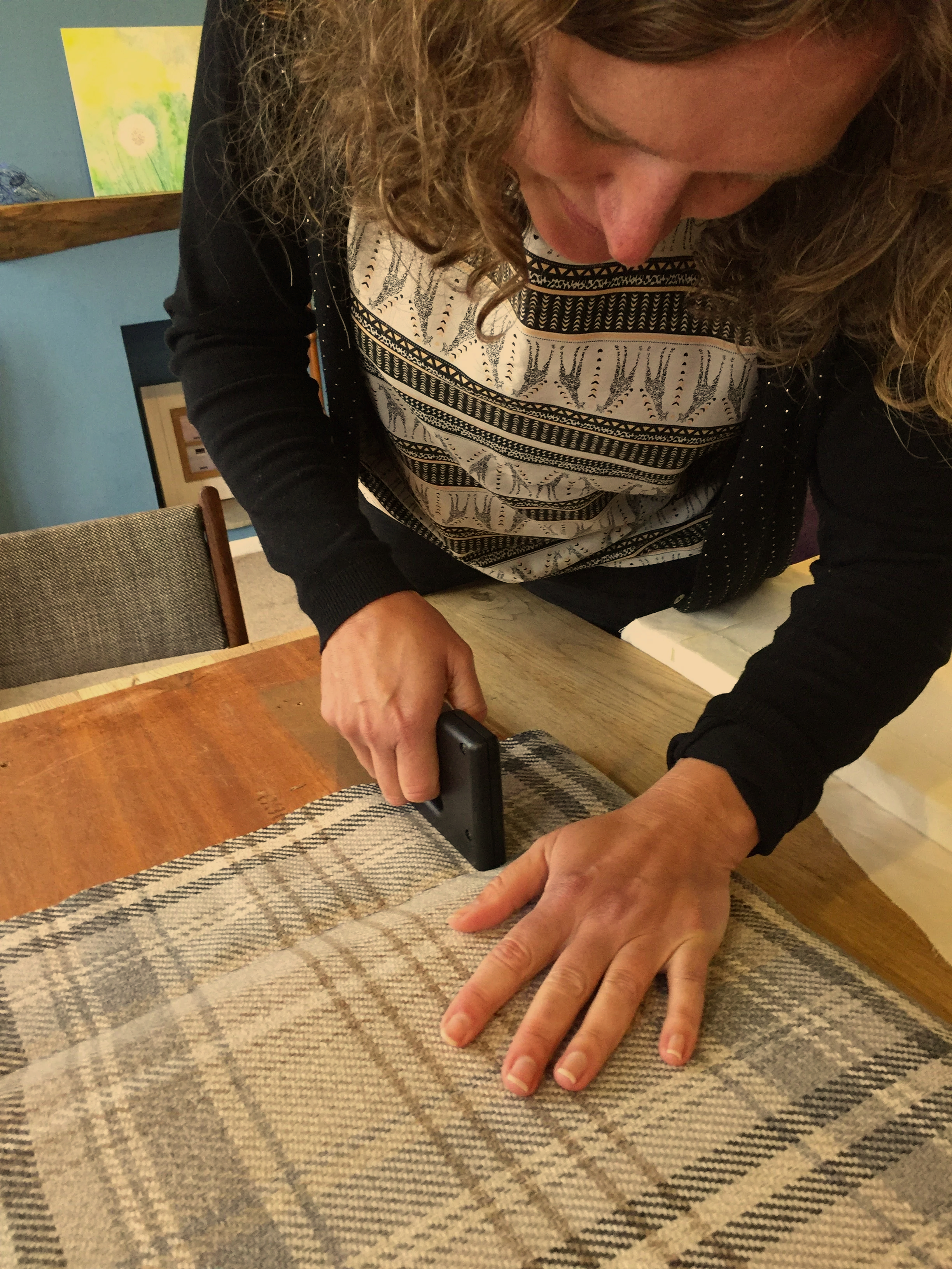 woman stapling upholstery