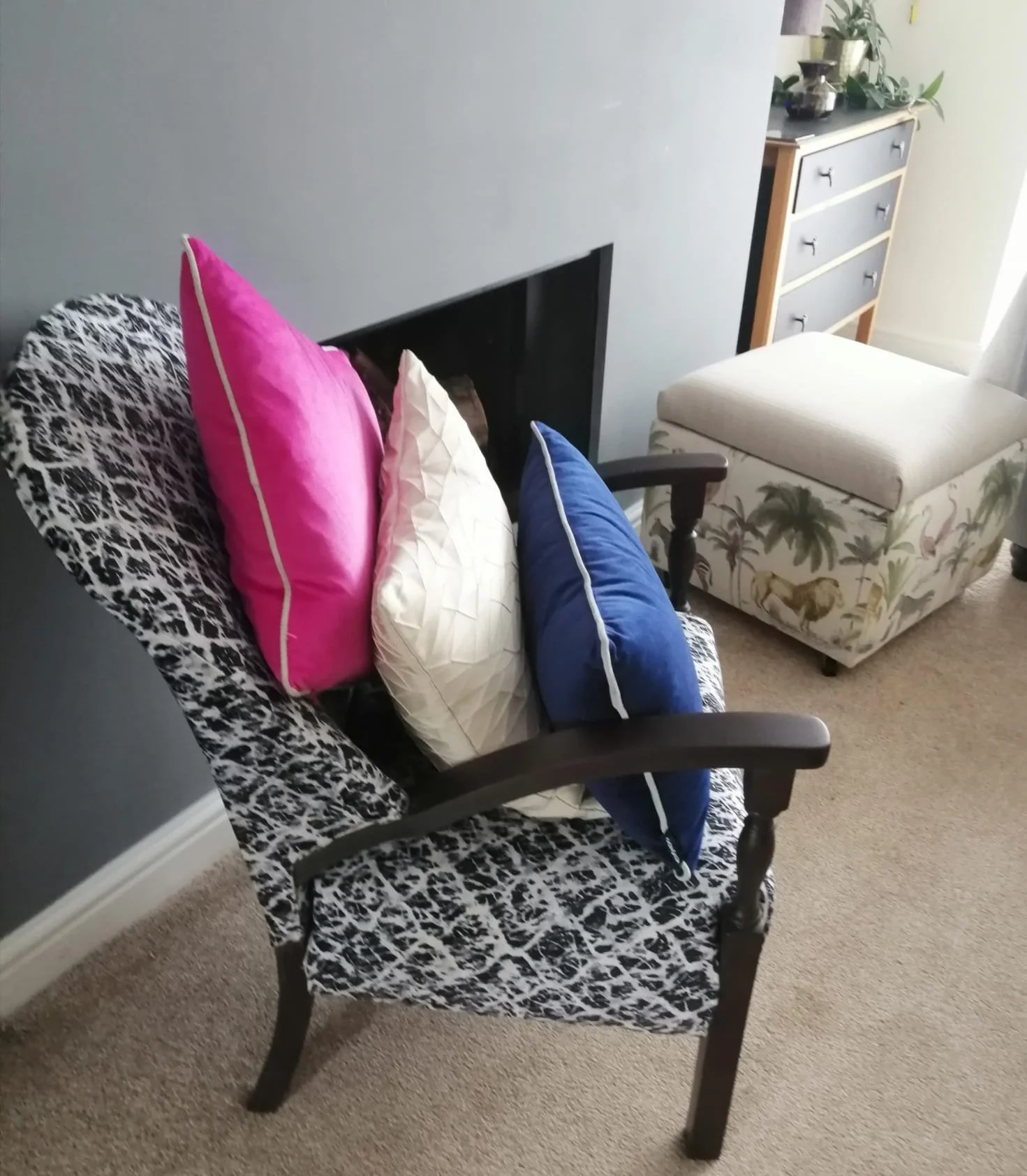 pink cream & navy cushins on pattern chair