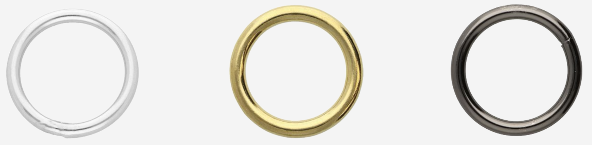 Three circular rings in silver, gold, and black colors arranged horizontally.