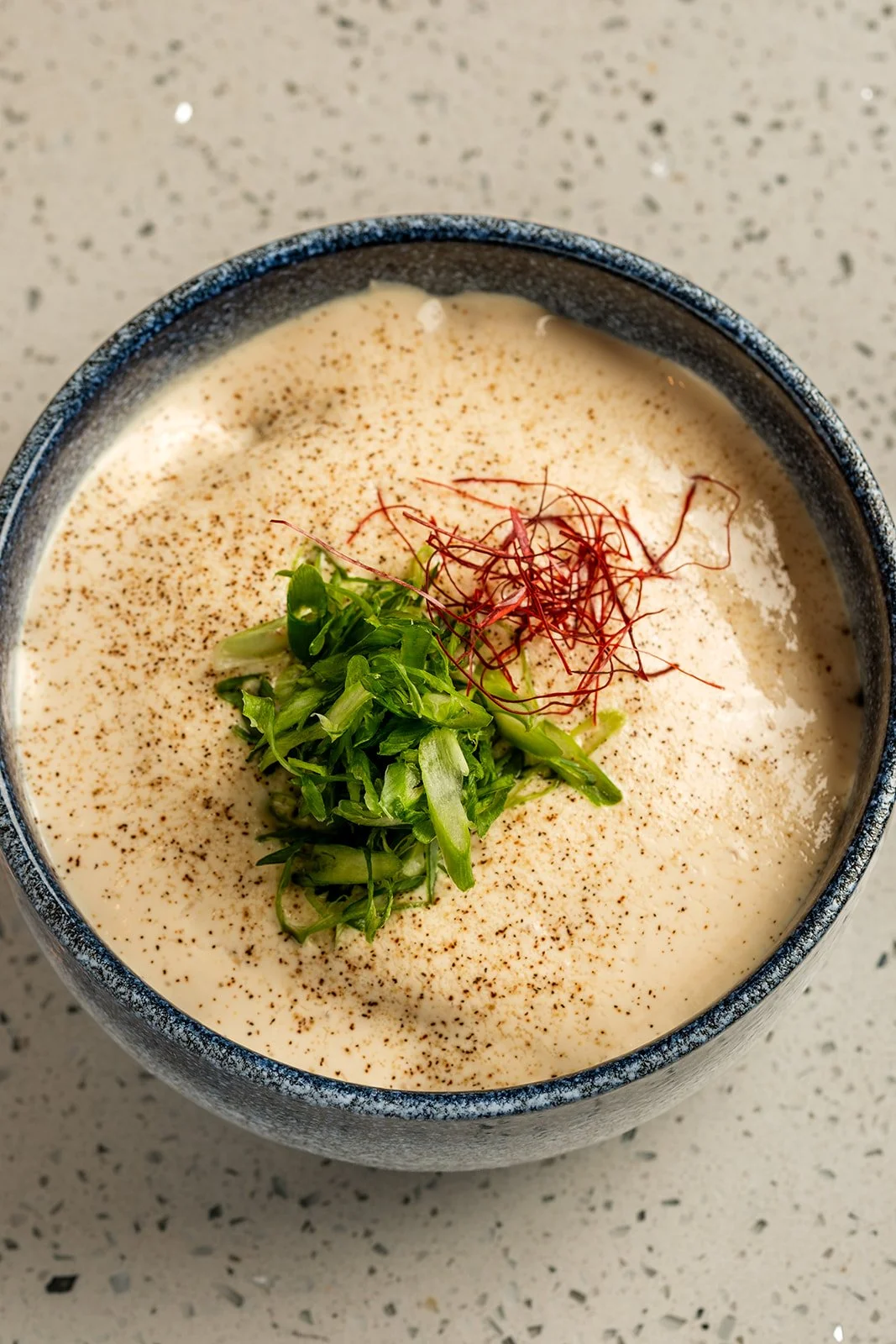 Mabo Tofu Udon (spicy; brothless) |
house udon + chicken mabo tofu sauce; topped w/ tofu espuma + sansho + scallions
$18.00