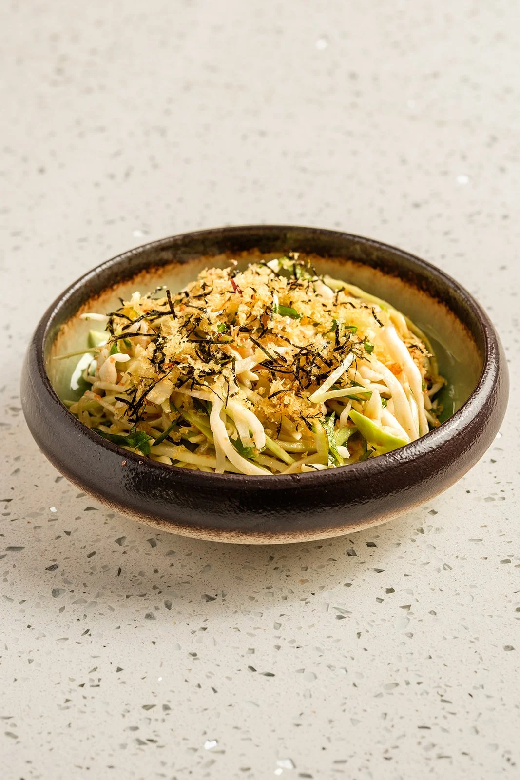 Mentaiko Salad |
cabbage + green onion + shiso + *mentaiko vinaigrette + nori crunch
$4.00