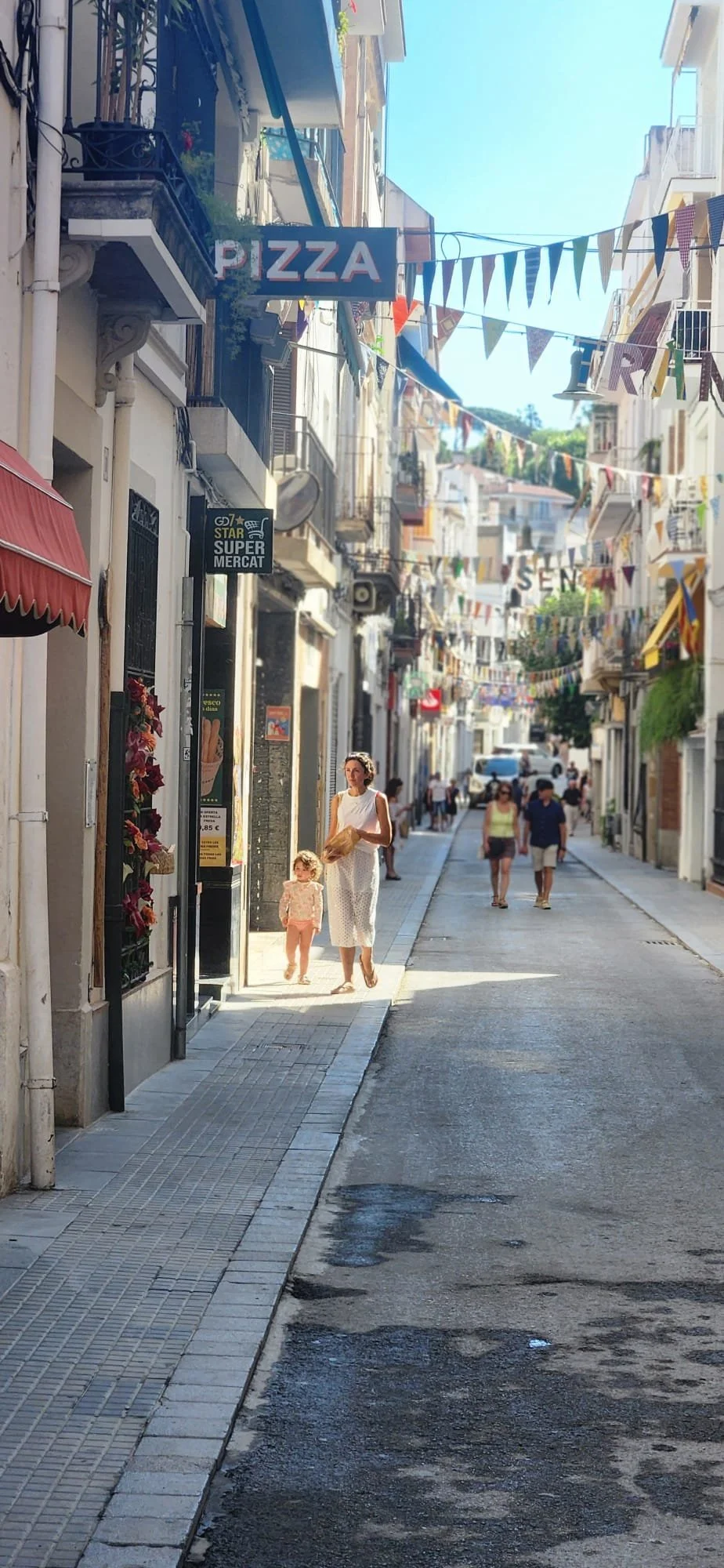 A street in a seaside down just north of Barcelona, San Pol de Mar, during a local summer festival