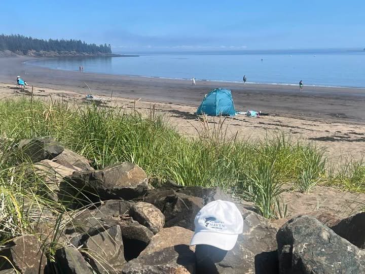 Hat enjoys Seal Cove Beach on Grand Manan, NB
