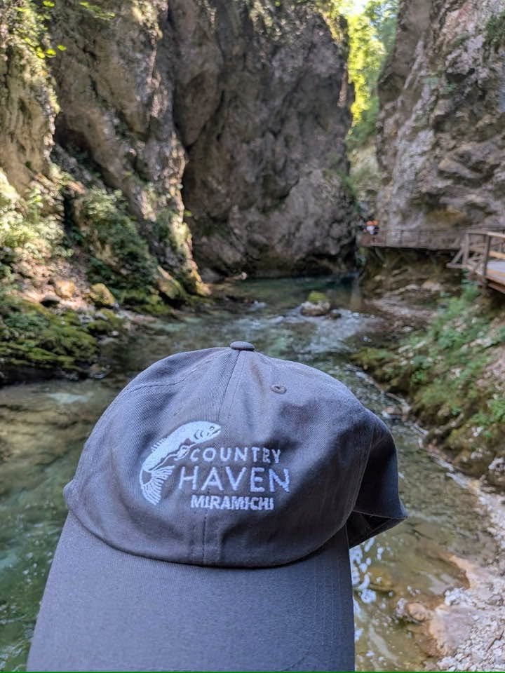 Hat is fishing the Rodovna River in Slovenia