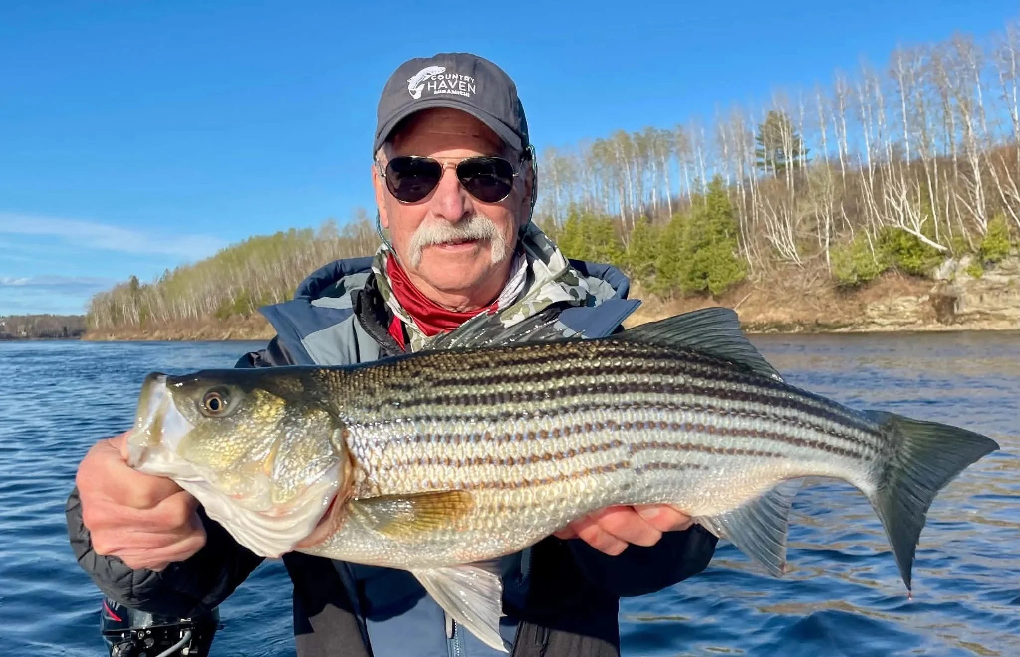 John Cleveland from Illionois and Hat and a nice Miramichi Striper