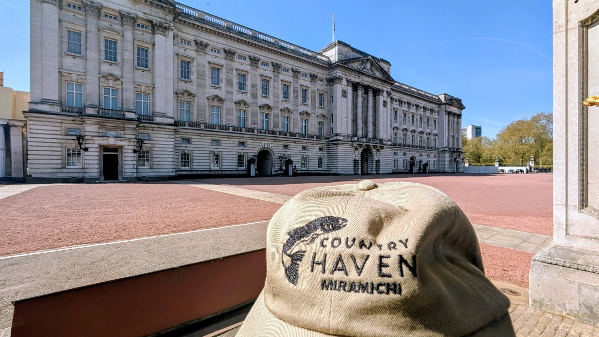 Hat is close to the King at Buckingham Pallace, London