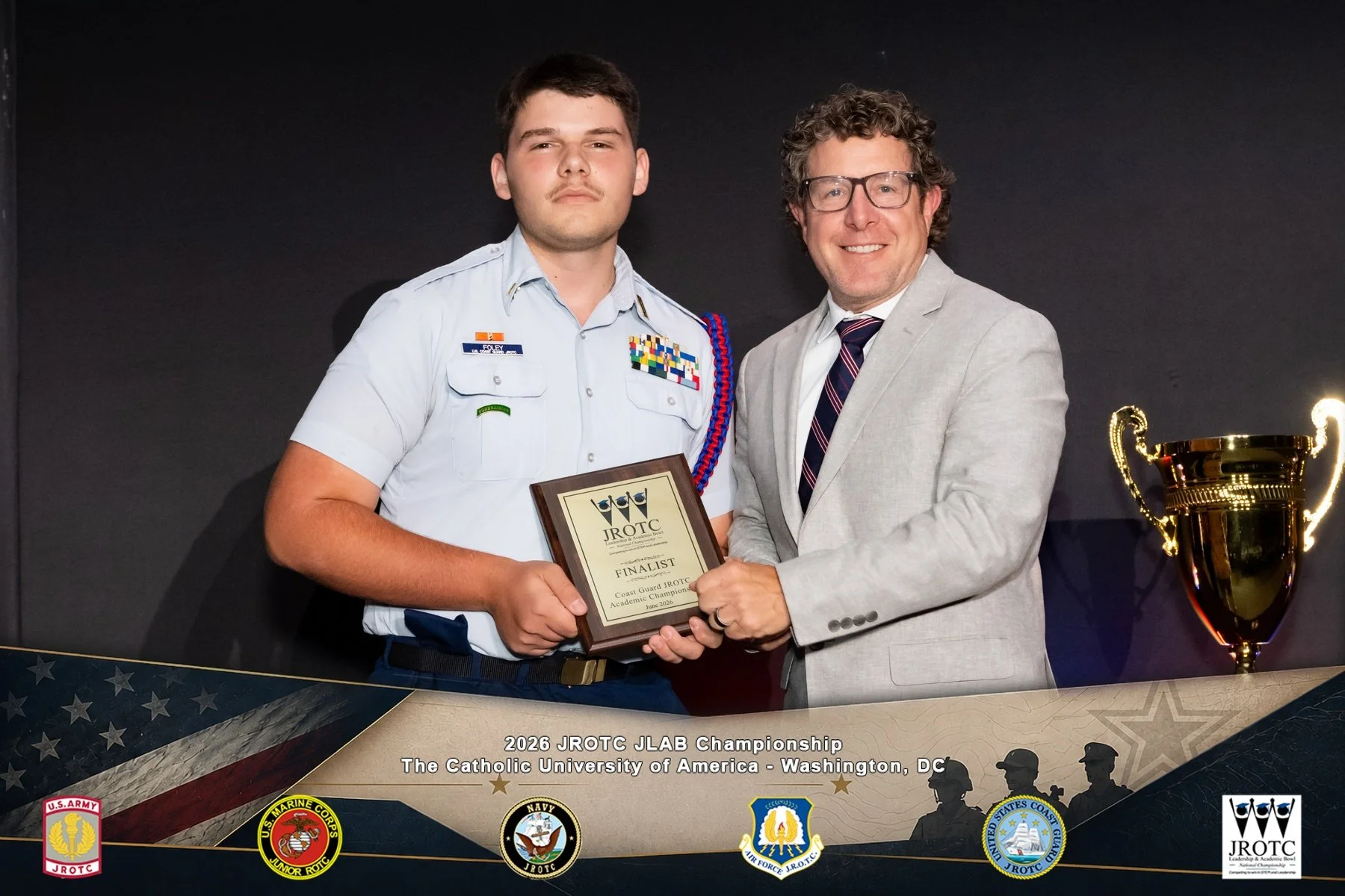 Team Captain Ensign Foley accepting award.