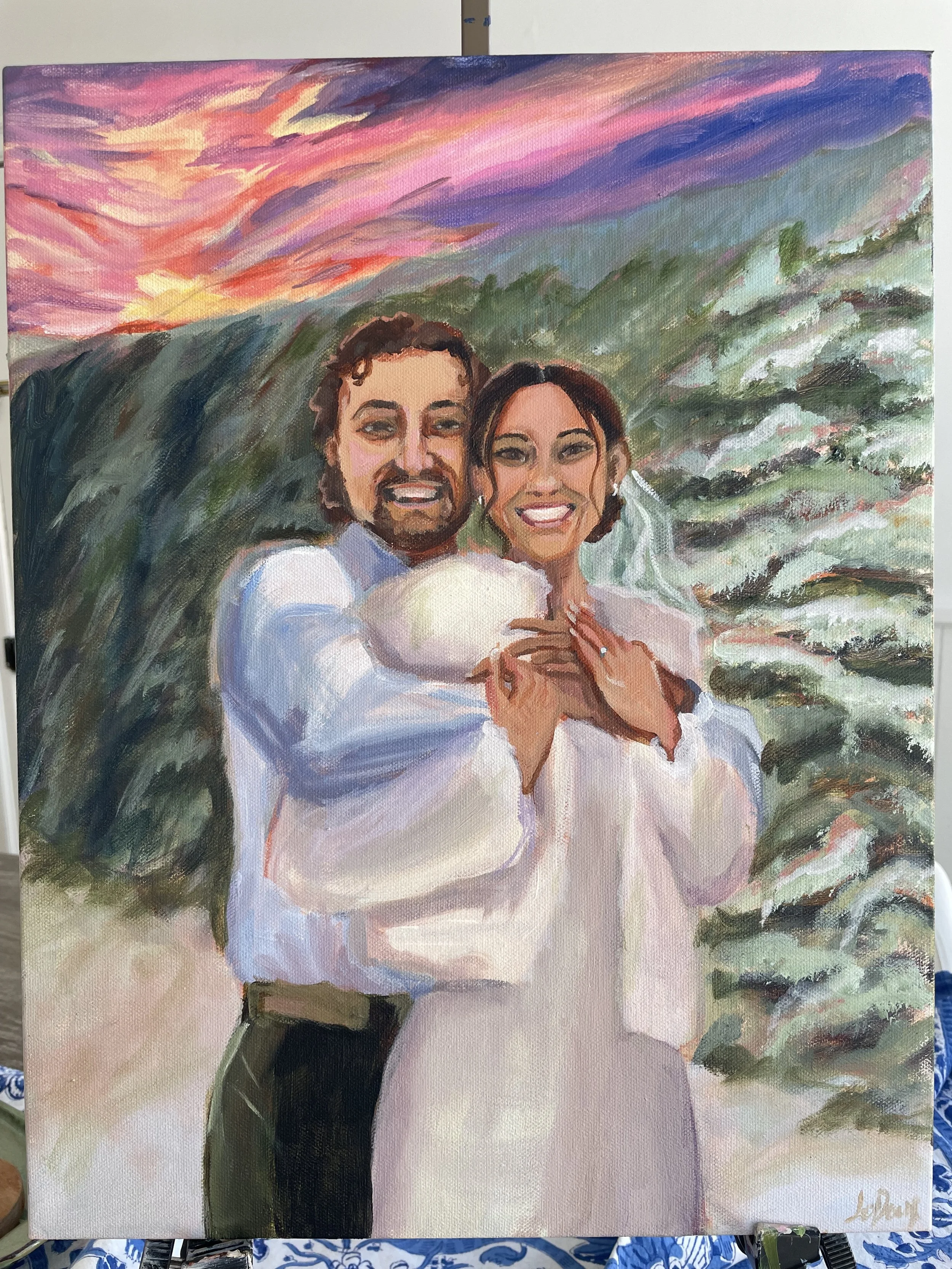 An abstract painting of a smiling couple outdoors at sunset with a colorful sky and a green landscape.