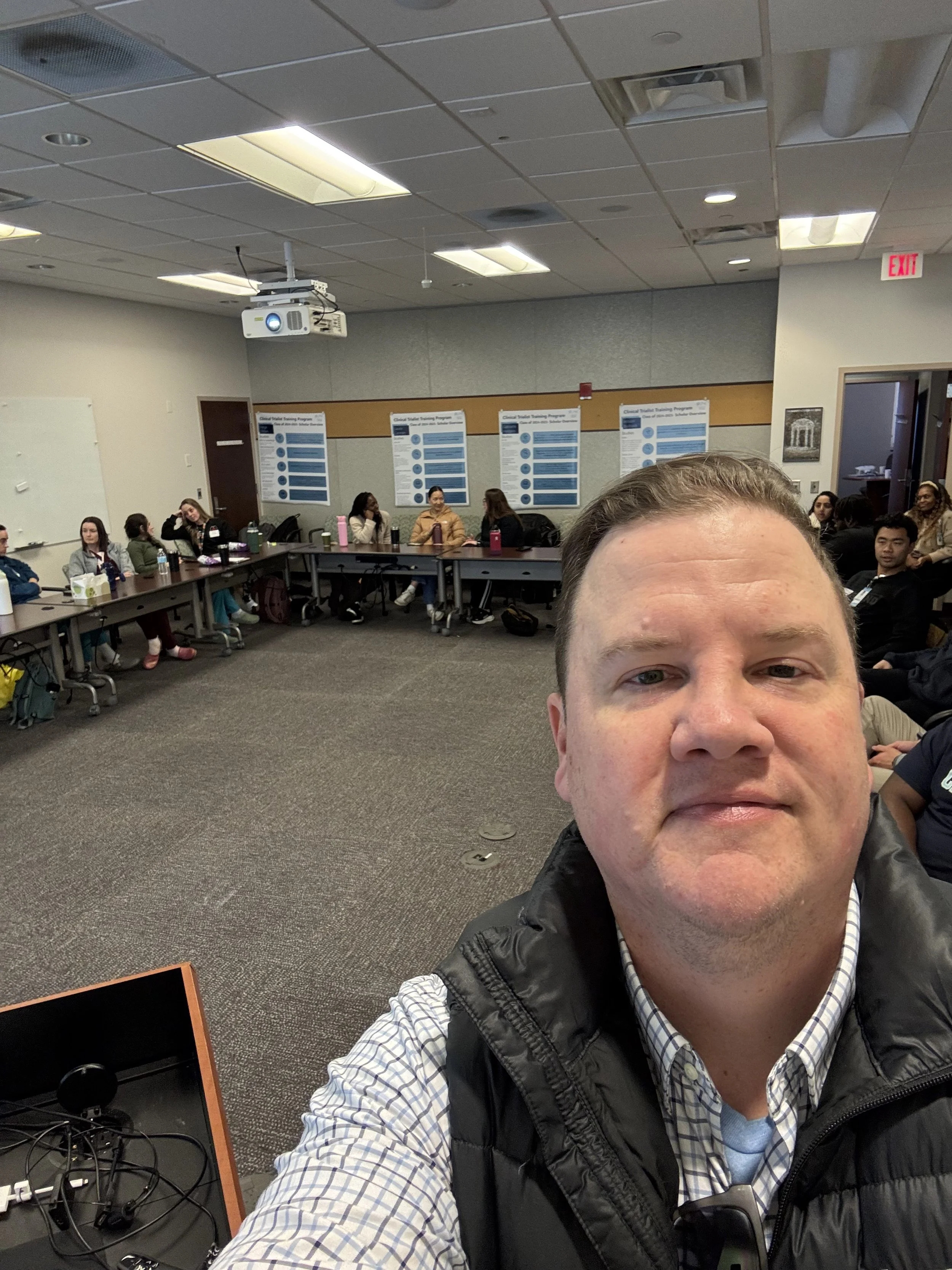 Joey Powell selfie while leading a class of med school residents.