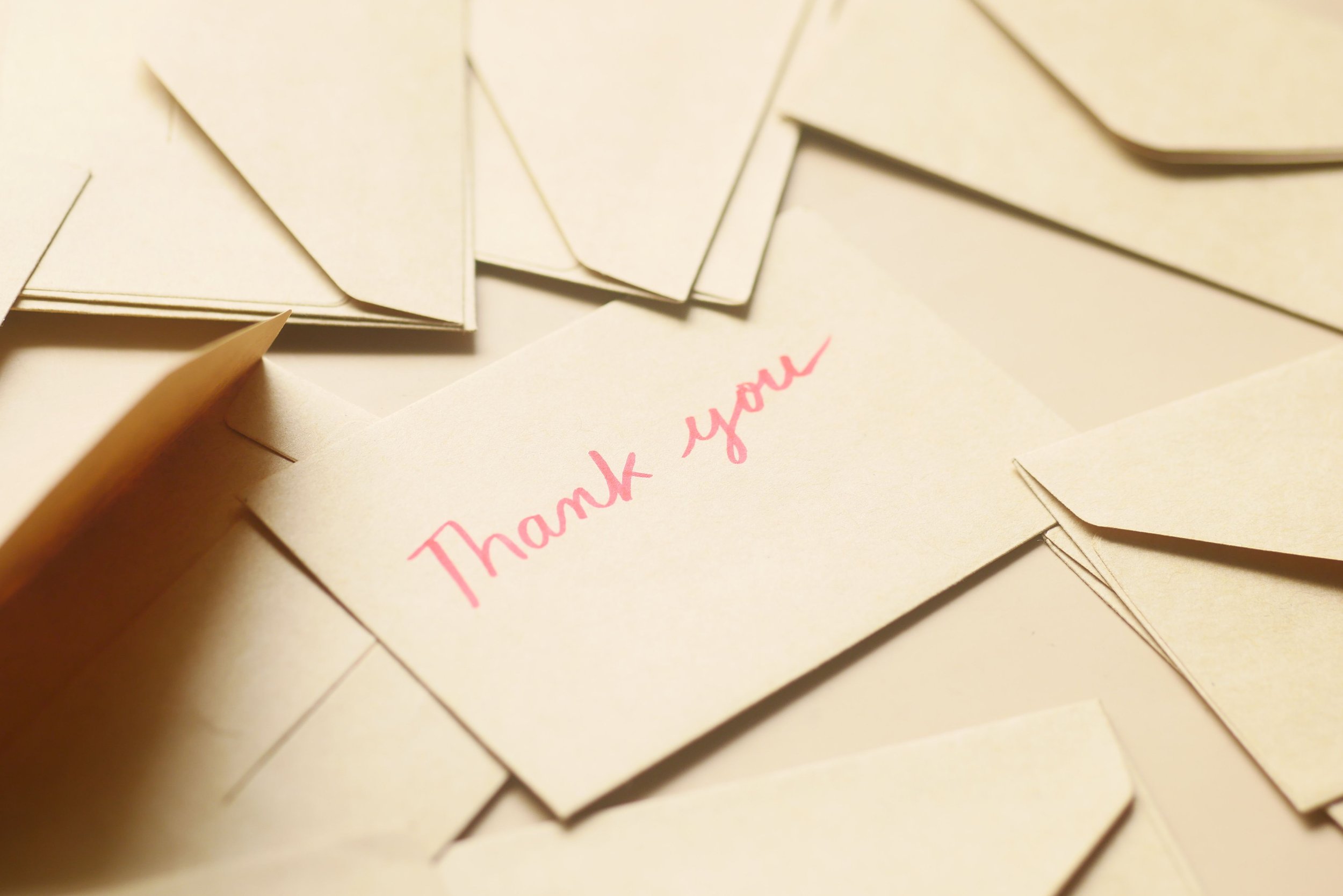 Handwritten donor thank-you cards prepared for mailing