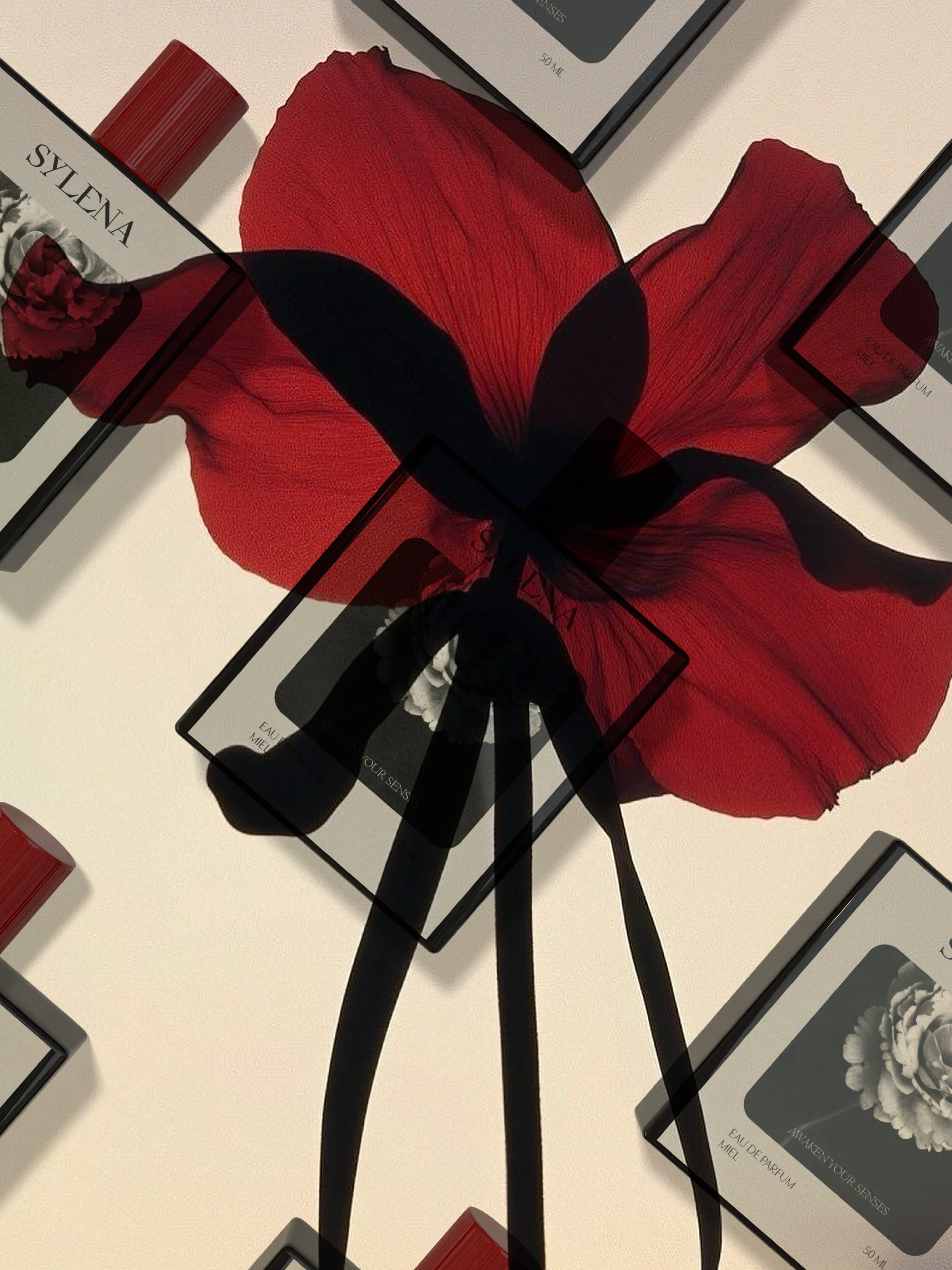 Several boxes of perfume with images of floral designs and red caps, placed on a plain, light-colored surface.
