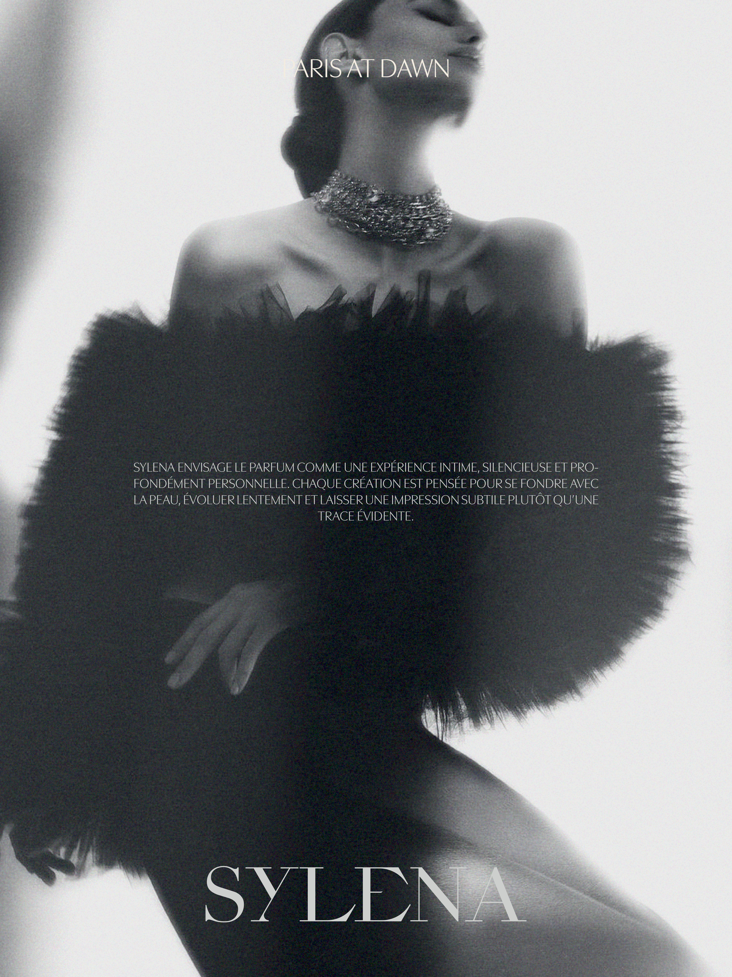Sylena Paris at Dawn campaign portrait of a woman in a pearl necklace and soft feathers