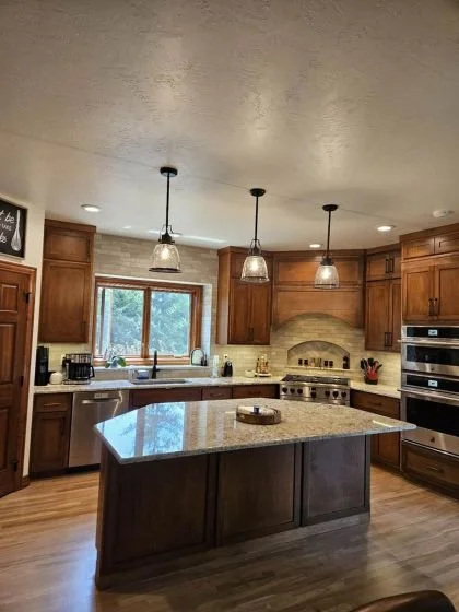 Custom Cabinets, brick Backsplash, Quartz Surfaces