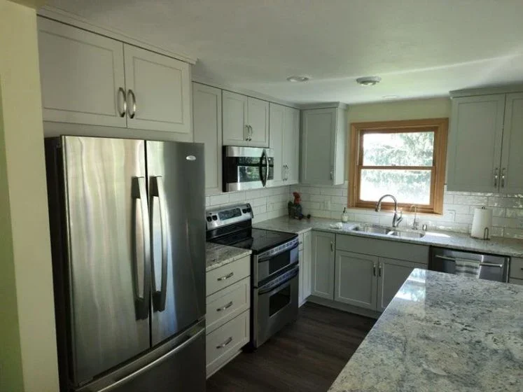 Complete Kitchen Remodel and Main Floor Millwork, with Custom Staircase in Entry