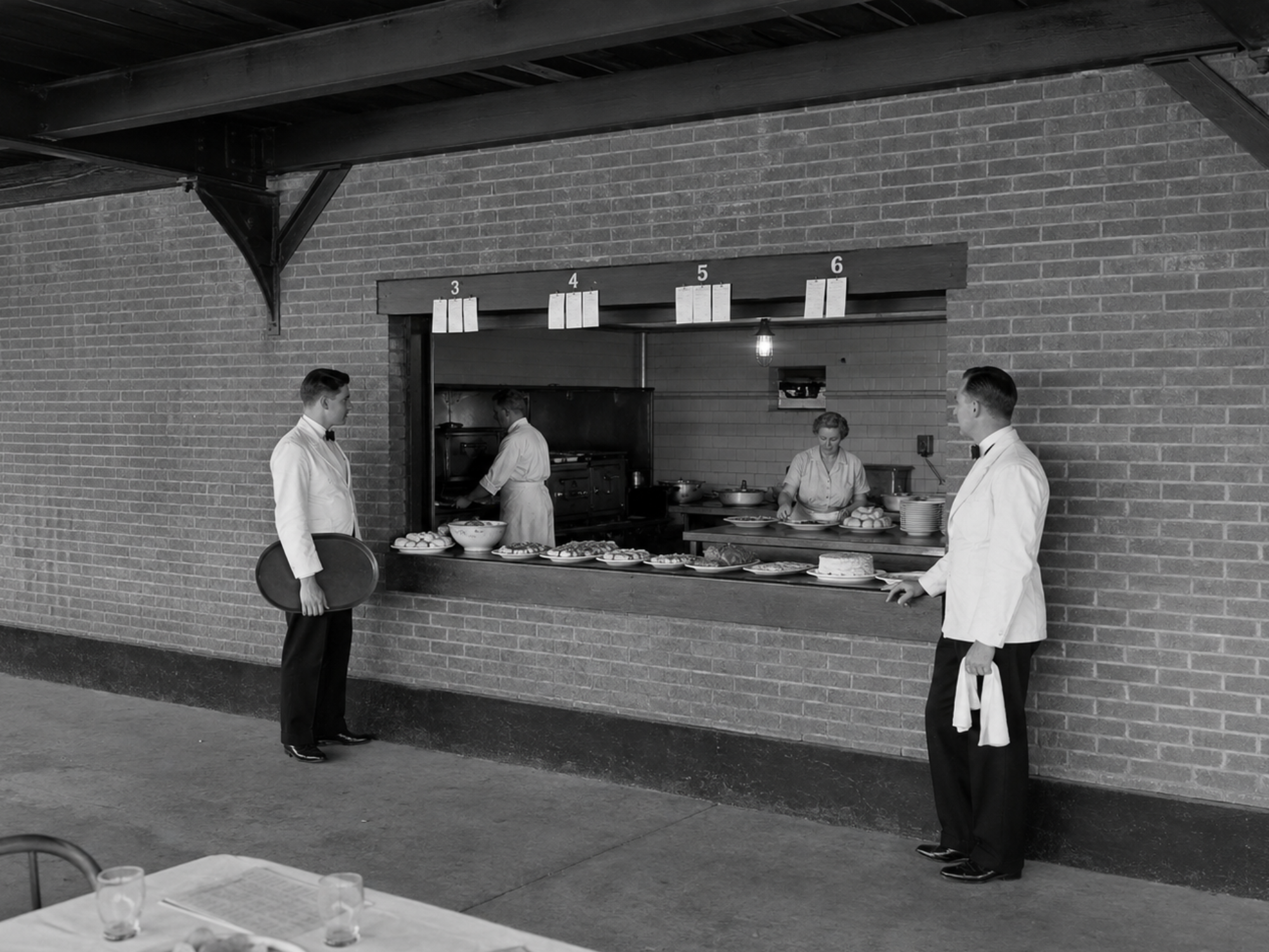 Kitchen staff prepare and organize supper orders during a Saratoga Springs Fascinators game at The Hatbox.