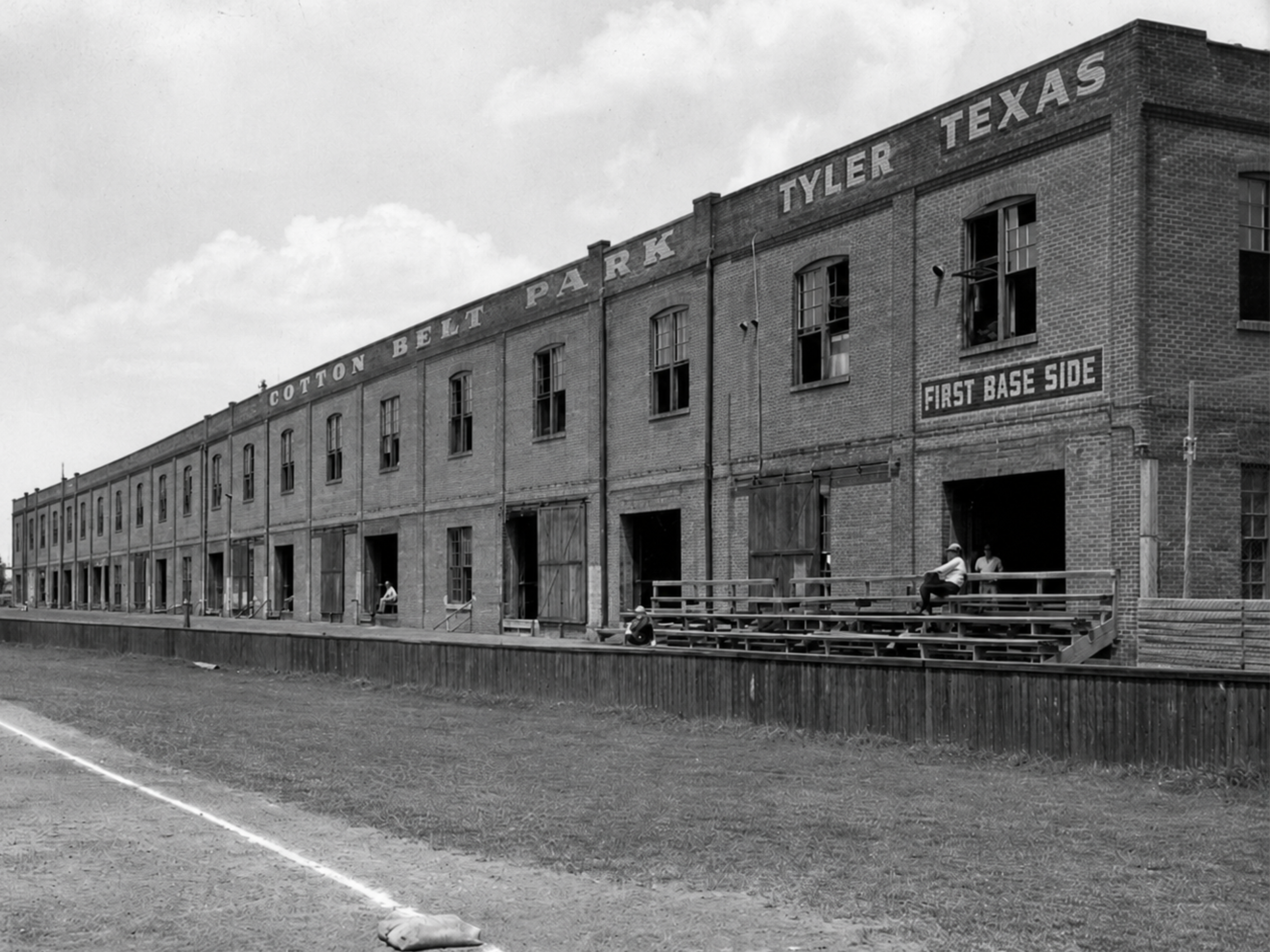Warehouse along first-base side.