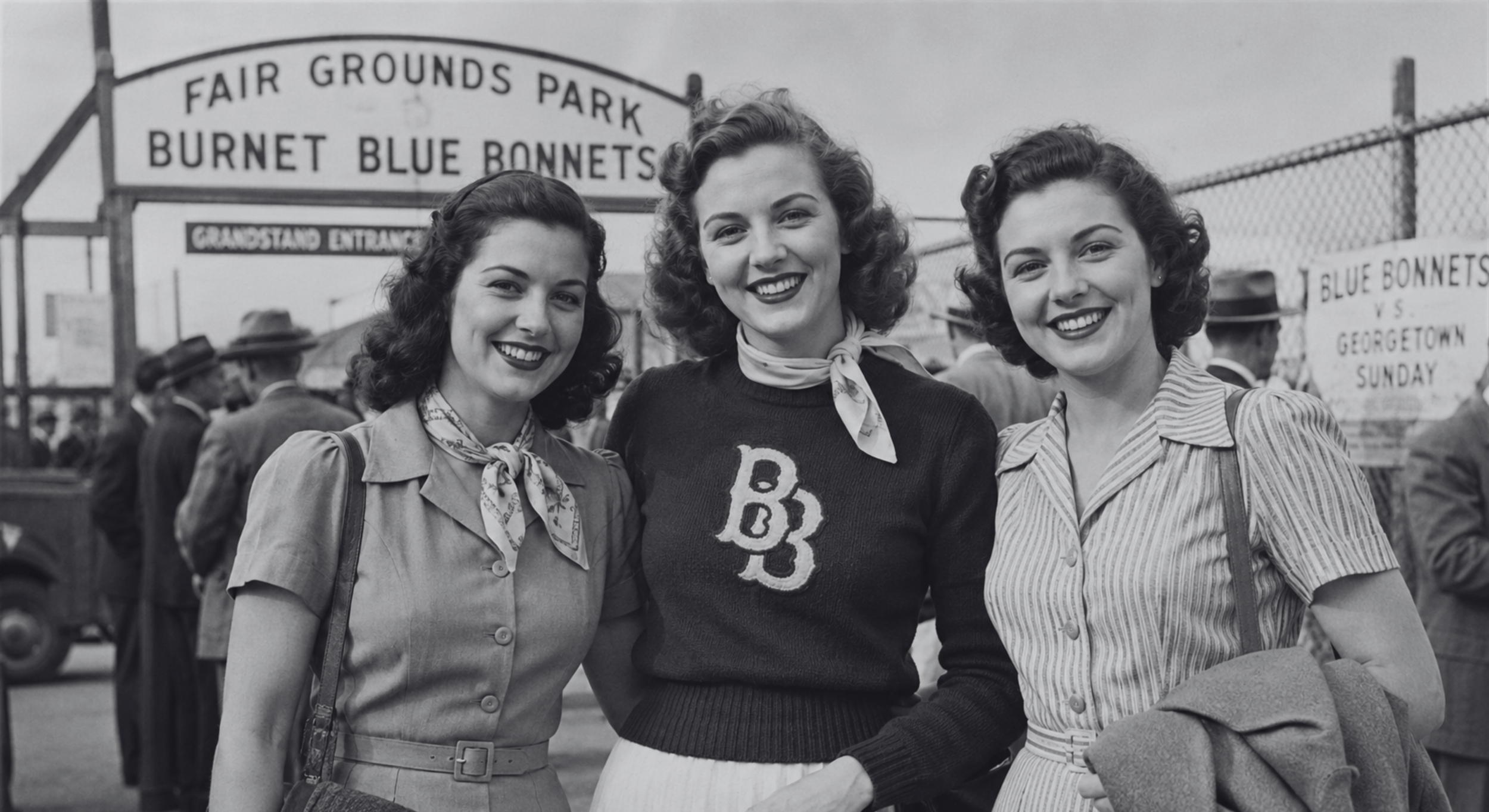 Black-and-white photograph of three women supporting the Burnet Blue Bonnets outside Fair Grounds Park before a Sunday game.