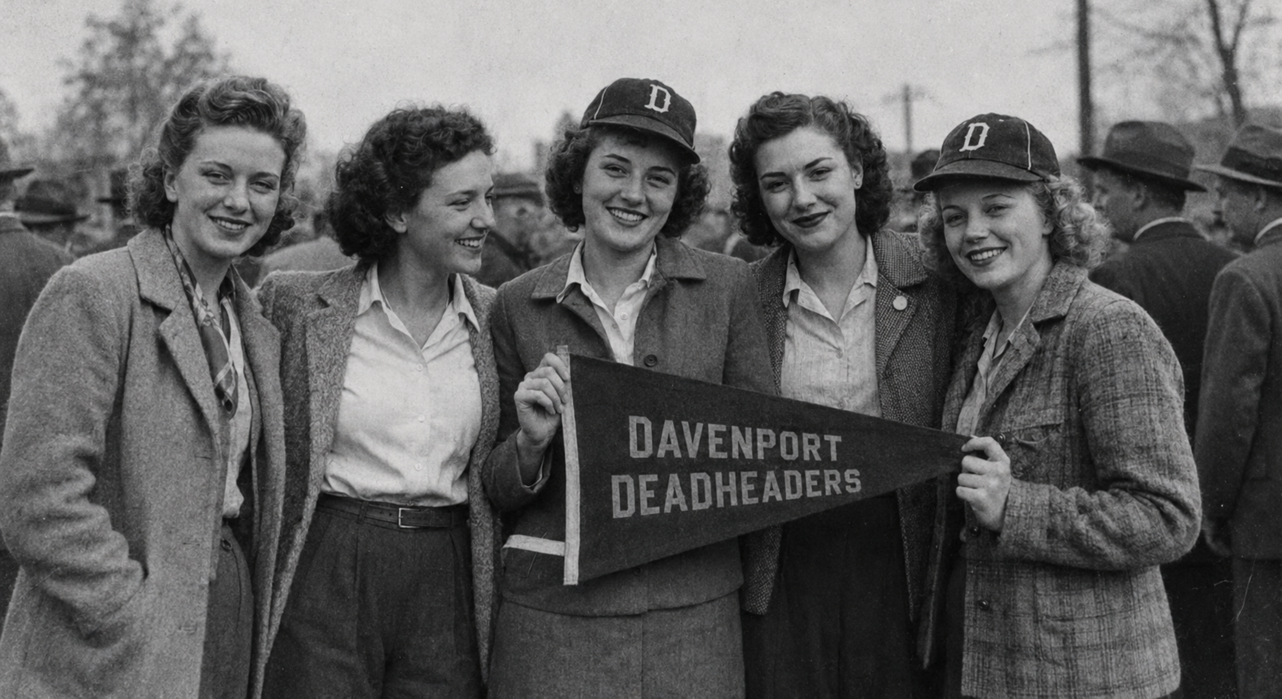 Female baseball fans photographed before a Davenport Deadheaders game.