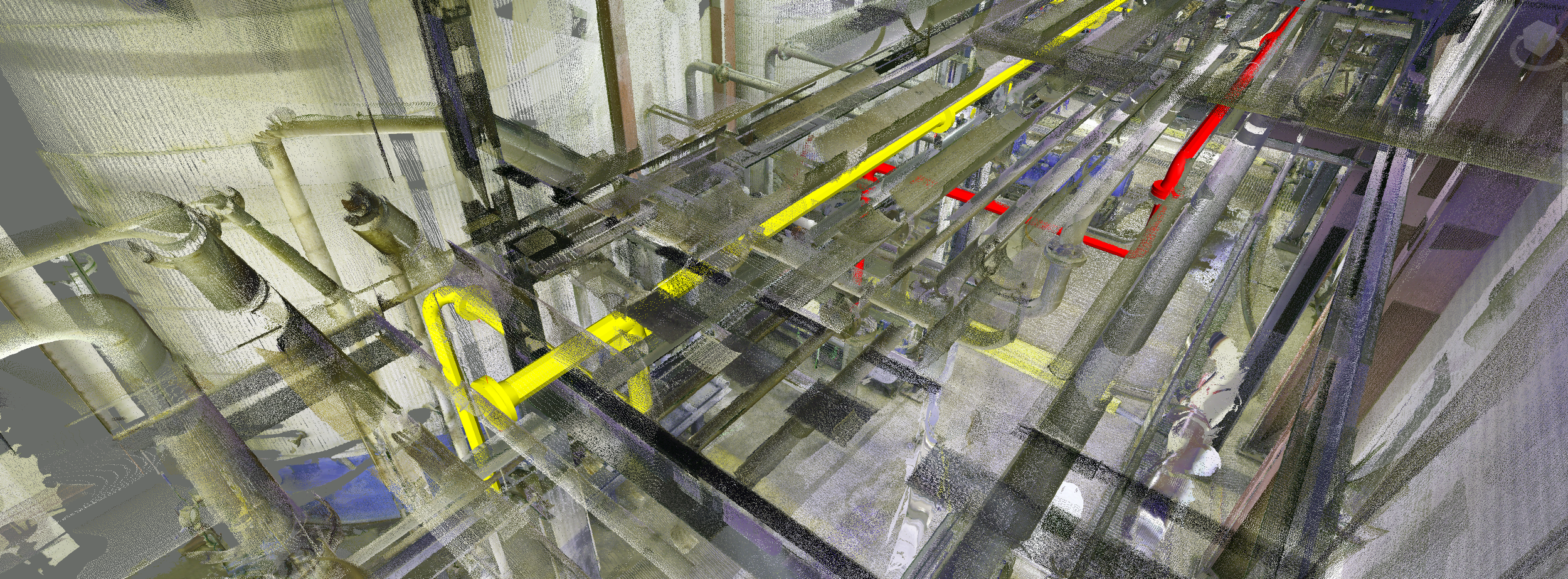 A complex industrial piping system with yellow, red, and gray pipes, along with black supports and structures in an industrial facility.