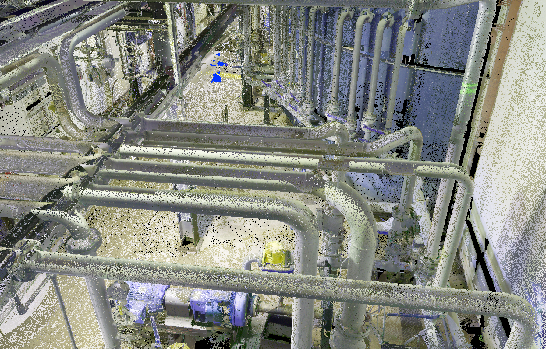 Industrial piping system with metal pipes and valves in a factory or plant setting.