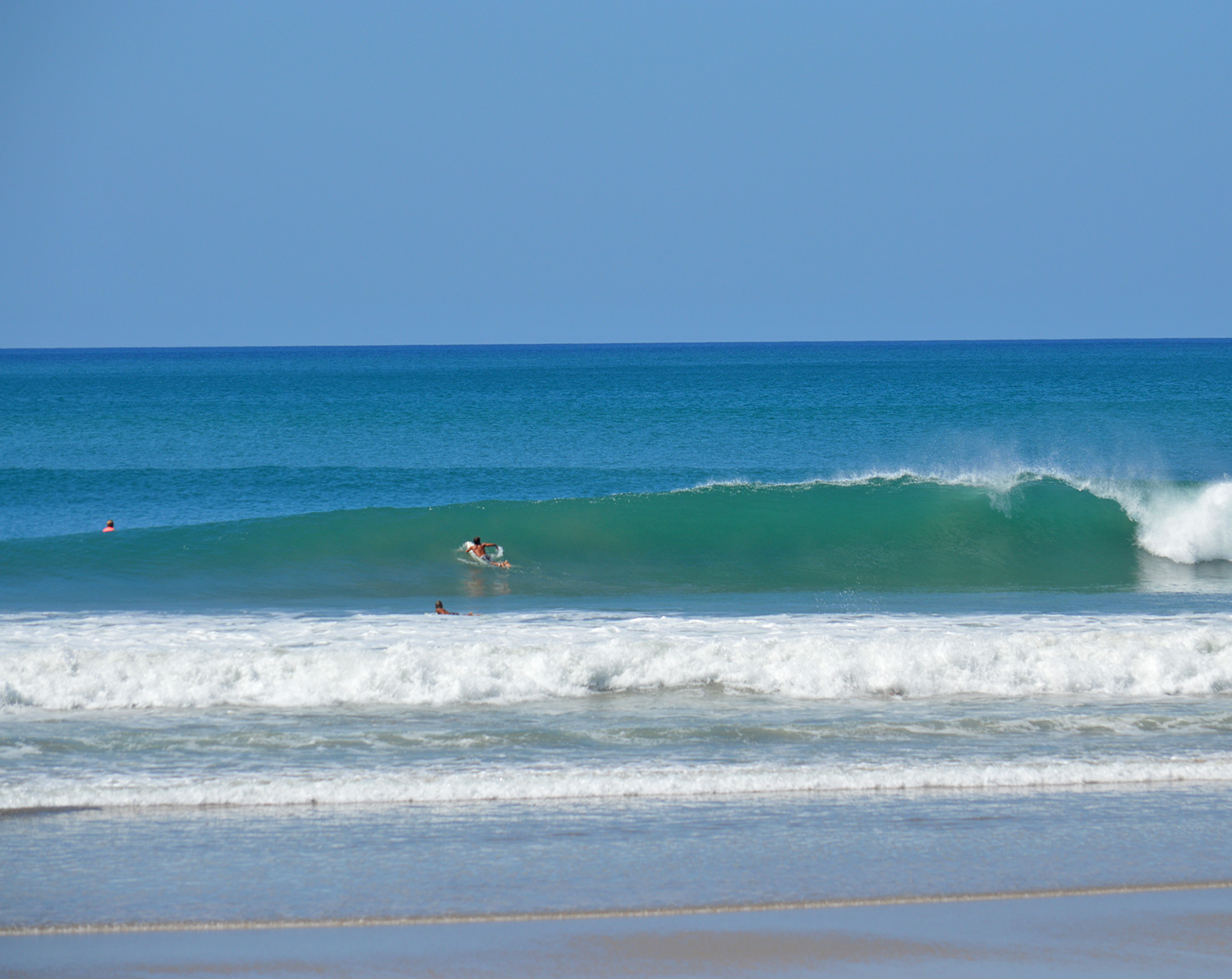 La Lora doing it's thing, a perfect right peeling as surfer paddles over the shoulder.