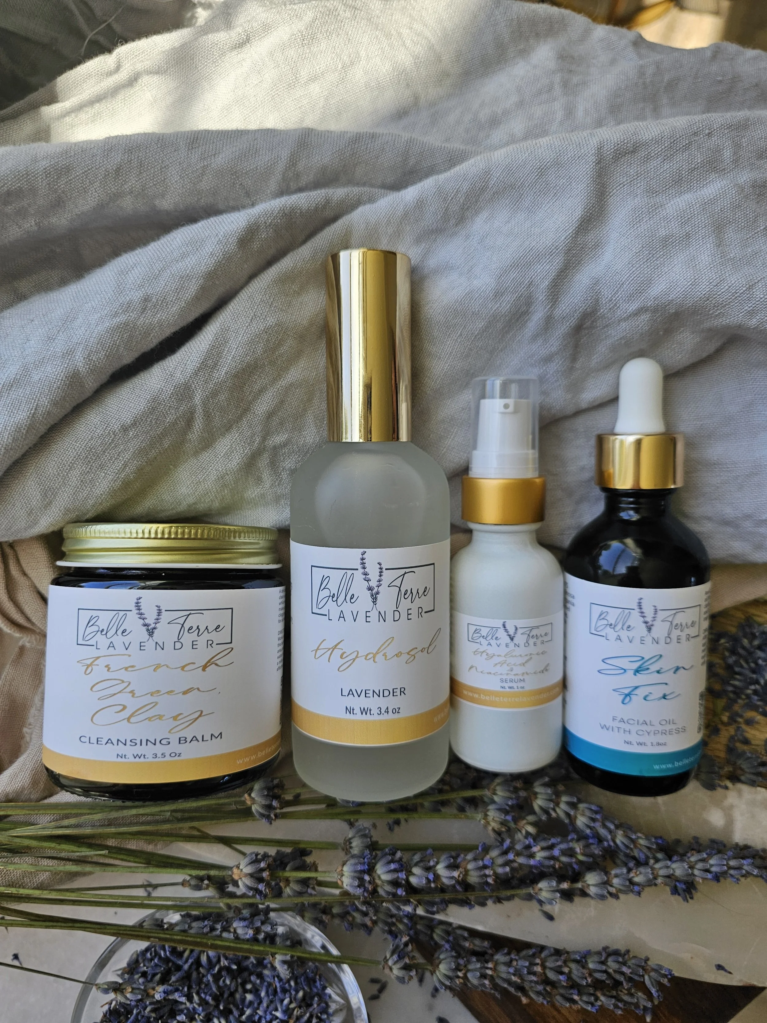 Belle Terre Lavender Renewal Collection skincare set with dried lavender