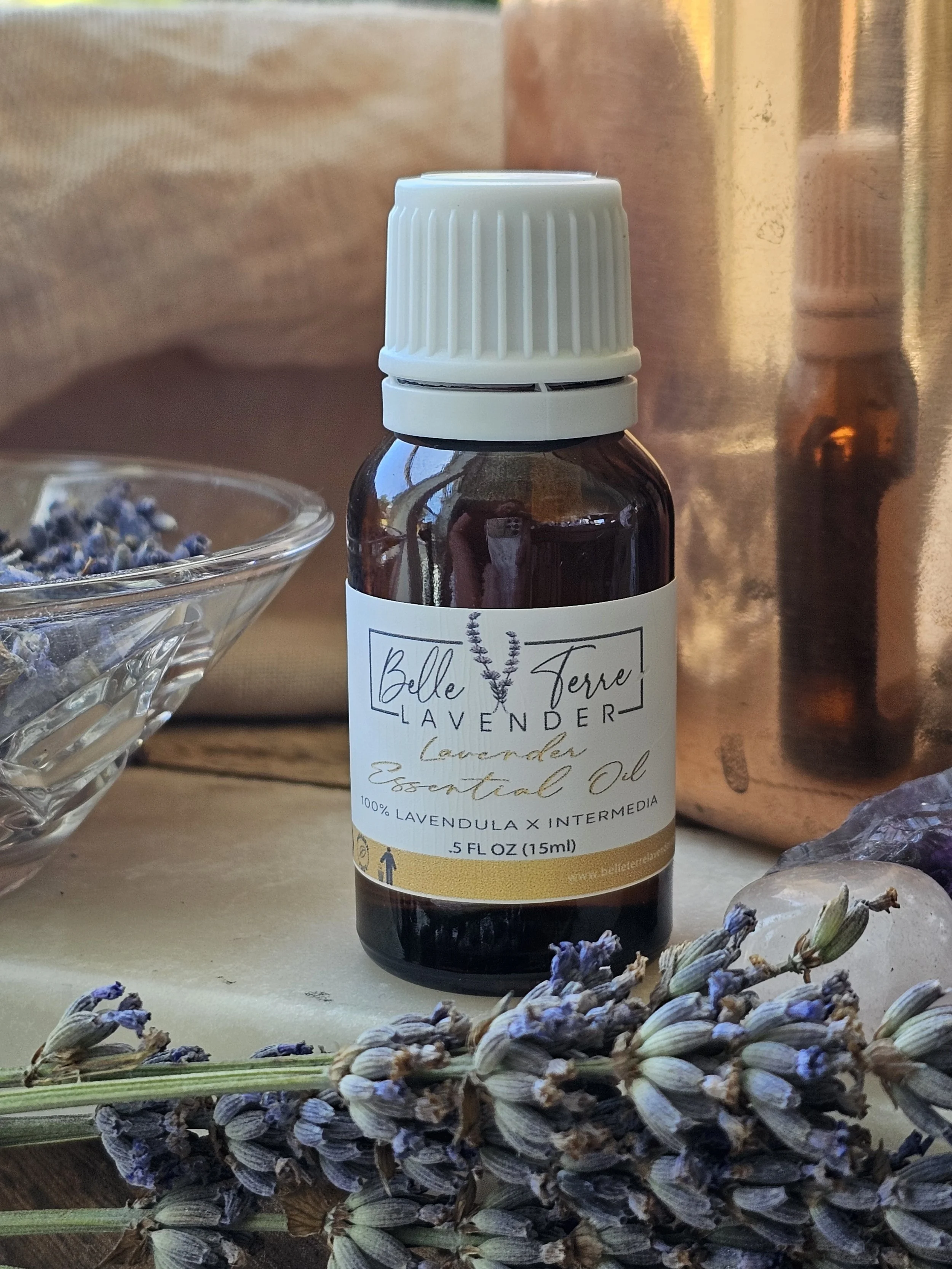 Belle Terre Lavender Essential Oil bottle with dried lavender