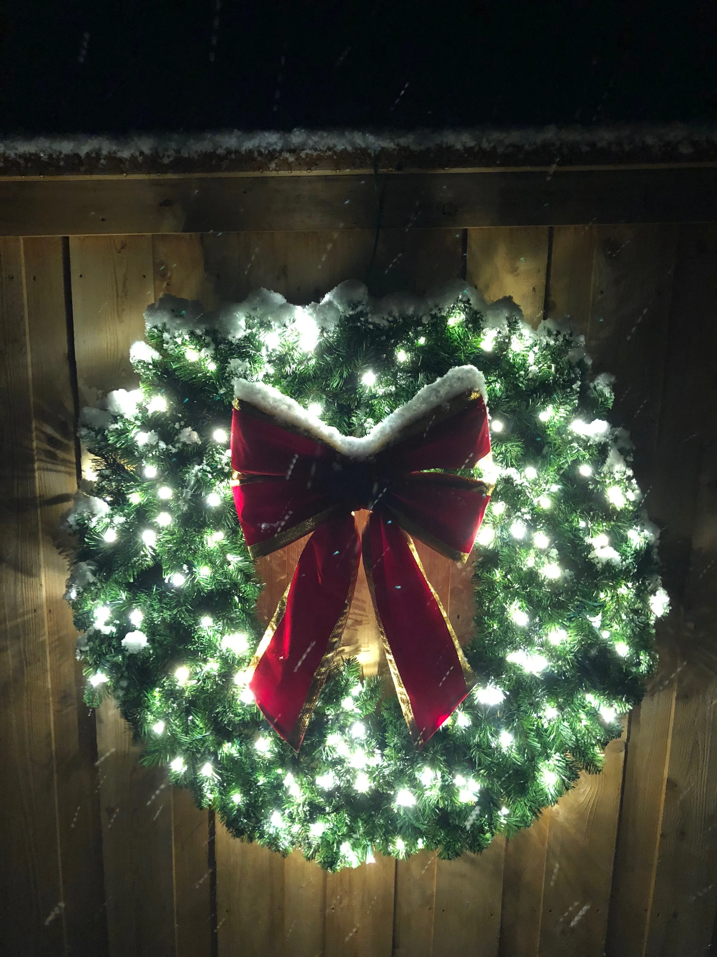 lit wreath with premium red bow 