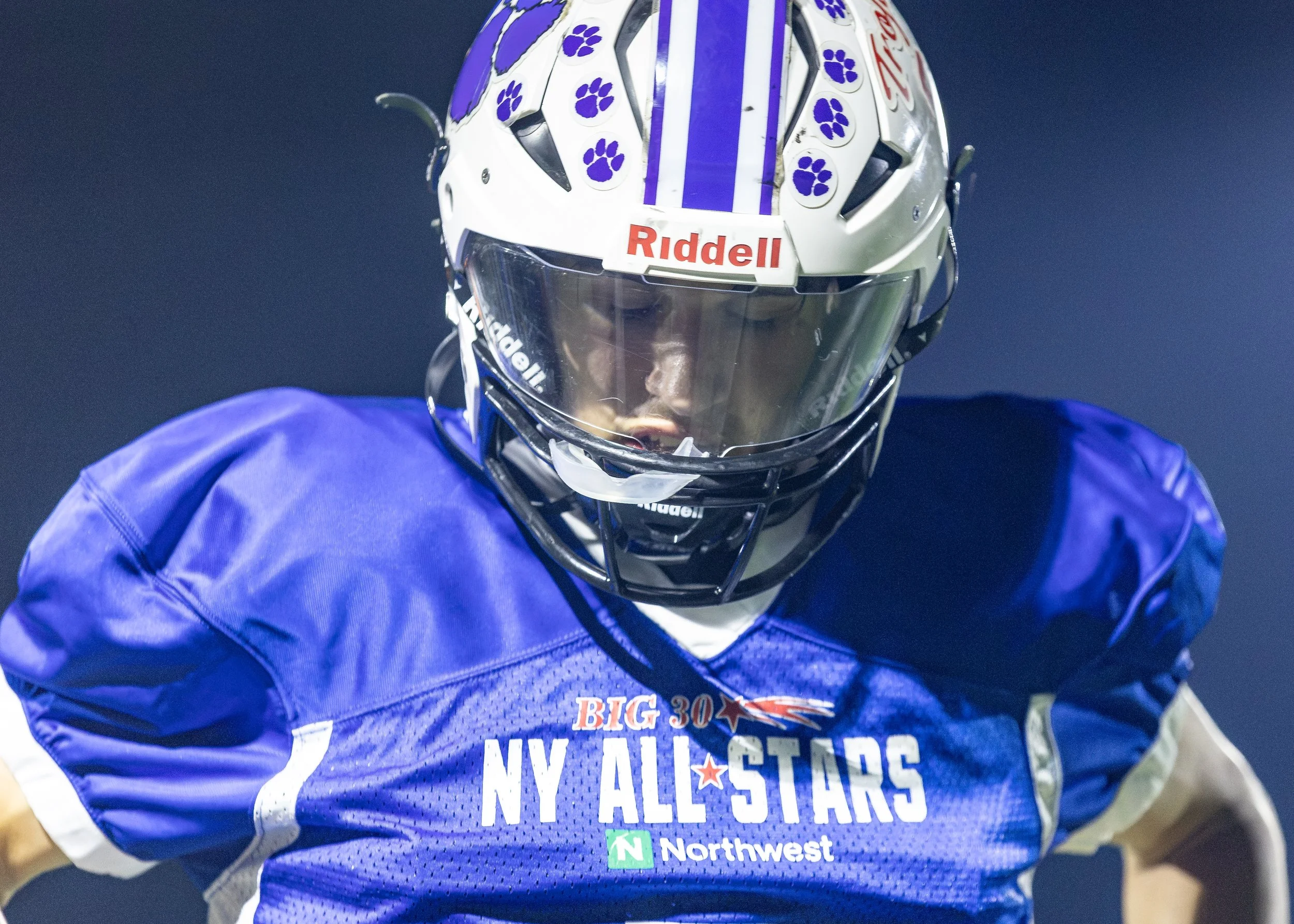 Big 30 All-Star Charities Classic football player wearing a blue New York All-Stars jersey and white helmet.