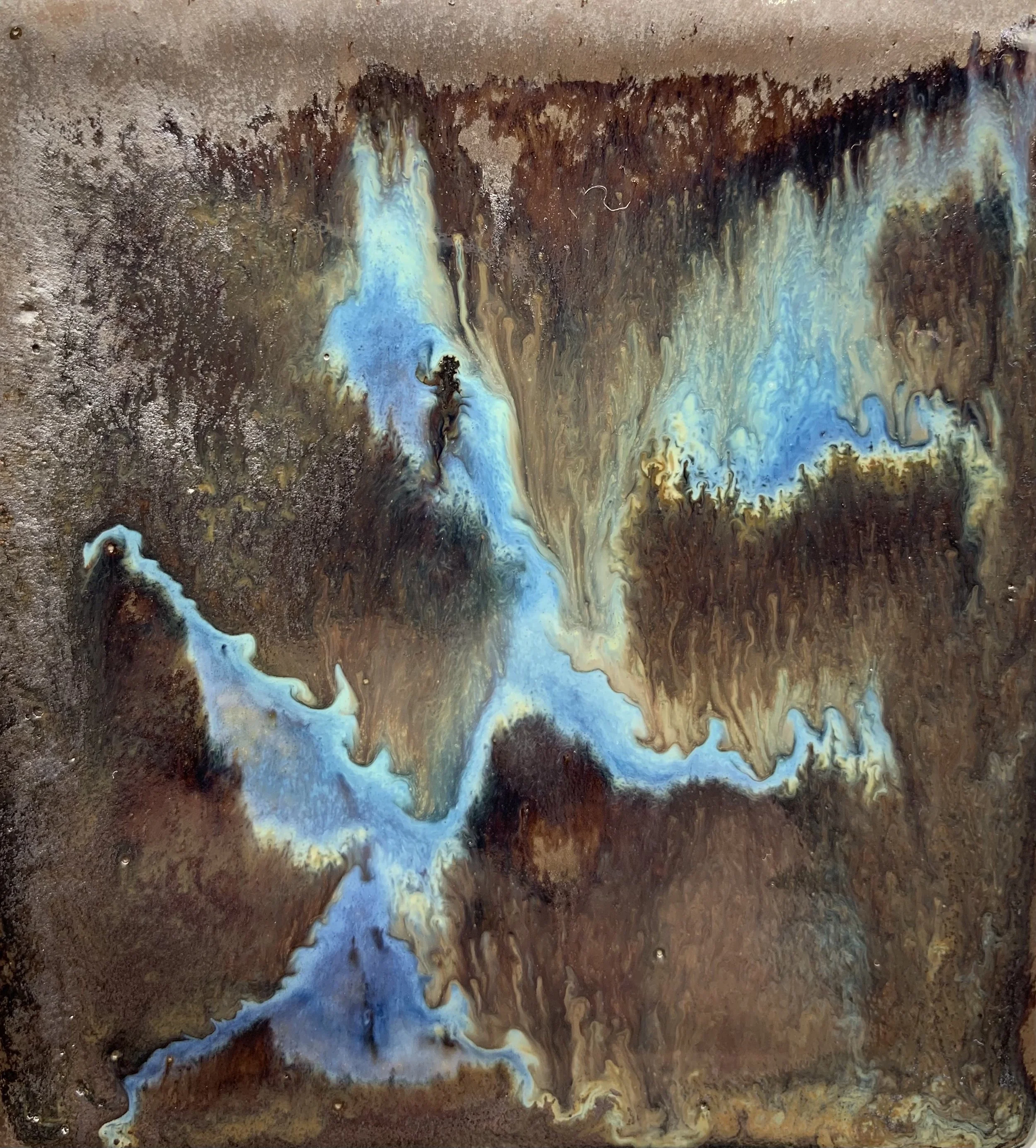 Abstract image featuring swirling patterns of blue, brown, and beige colors, resembling a fluid or molten surface.