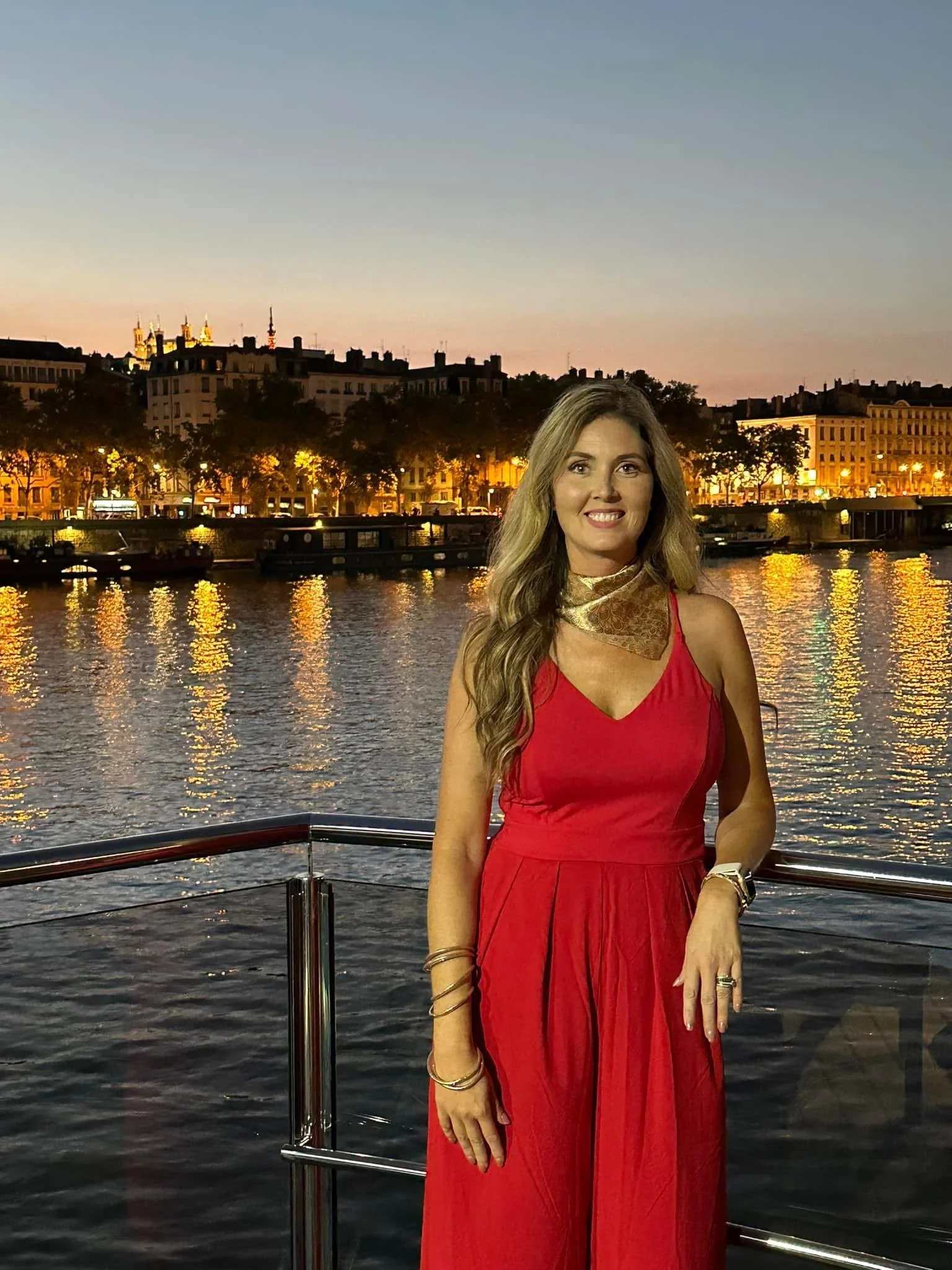 Christa Norris Turner on a European river cruise at sunset in Lyon, France