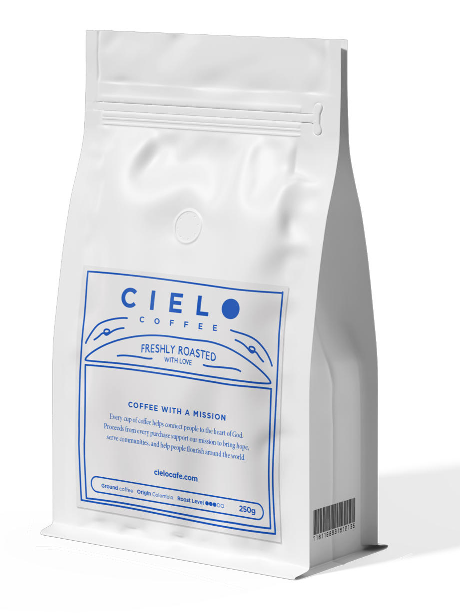 A white bag of Cielo Coffee with blue text and design, labeled 'Freshly Roasted with Love', containing 250 grams of ground coffee.