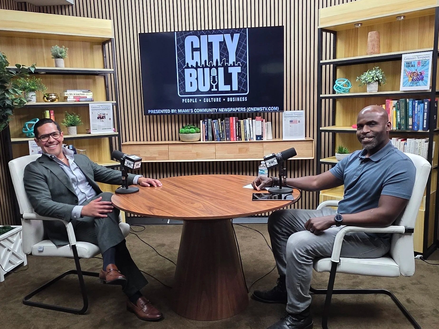 Irvans Augustin interviewing a guest at the City Built studio table