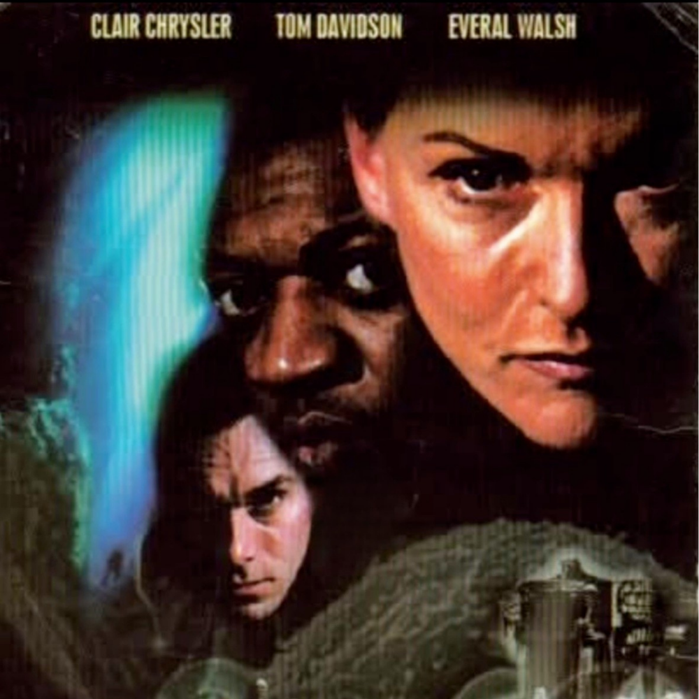 This is a movie poster featuring the names Clair Chrysler, Tom Davidson, and Everal Walsh at the top. The poster displays close-up images of four faces with intense expressions, suggesting a dramatic or action theme. The background includes a structu