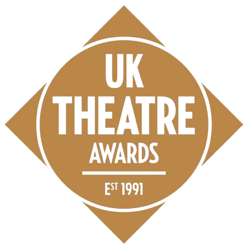 A digital graphic design of a circular badge with the text 'UK THEATRE AWARDS 1991' in colorful and bold letters, surrounded by a brown diamond shape overlay.