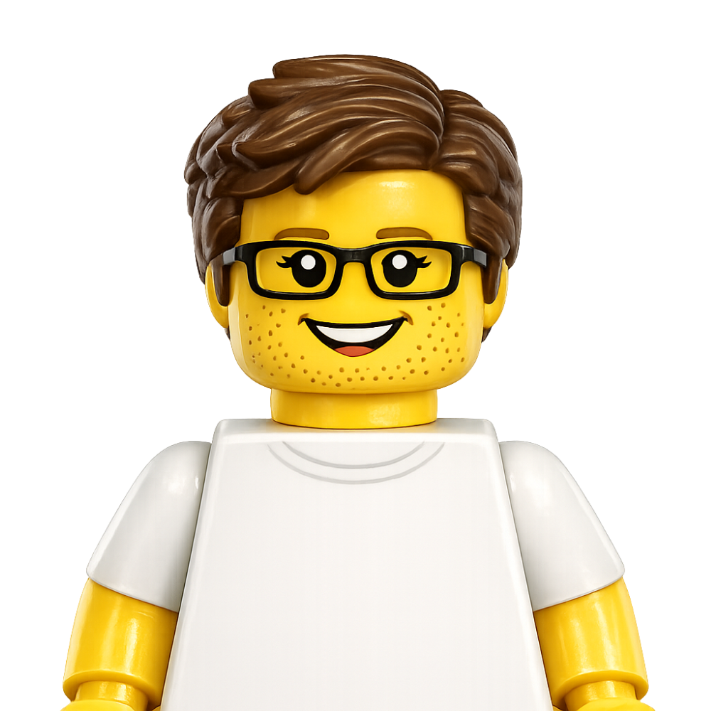 LEGO minifigure of a smiling person with glasses, brown hair, and light facial stubble, wearing a plain white T-shirt.