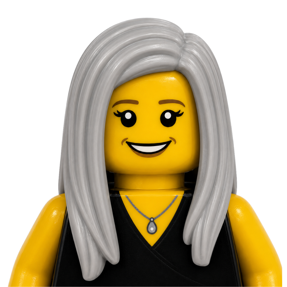 LEGO figure of a woman with long gray hair, a yellow face, black eyes with eyeliner, a black top, and a necklace with a teardrop pendant.