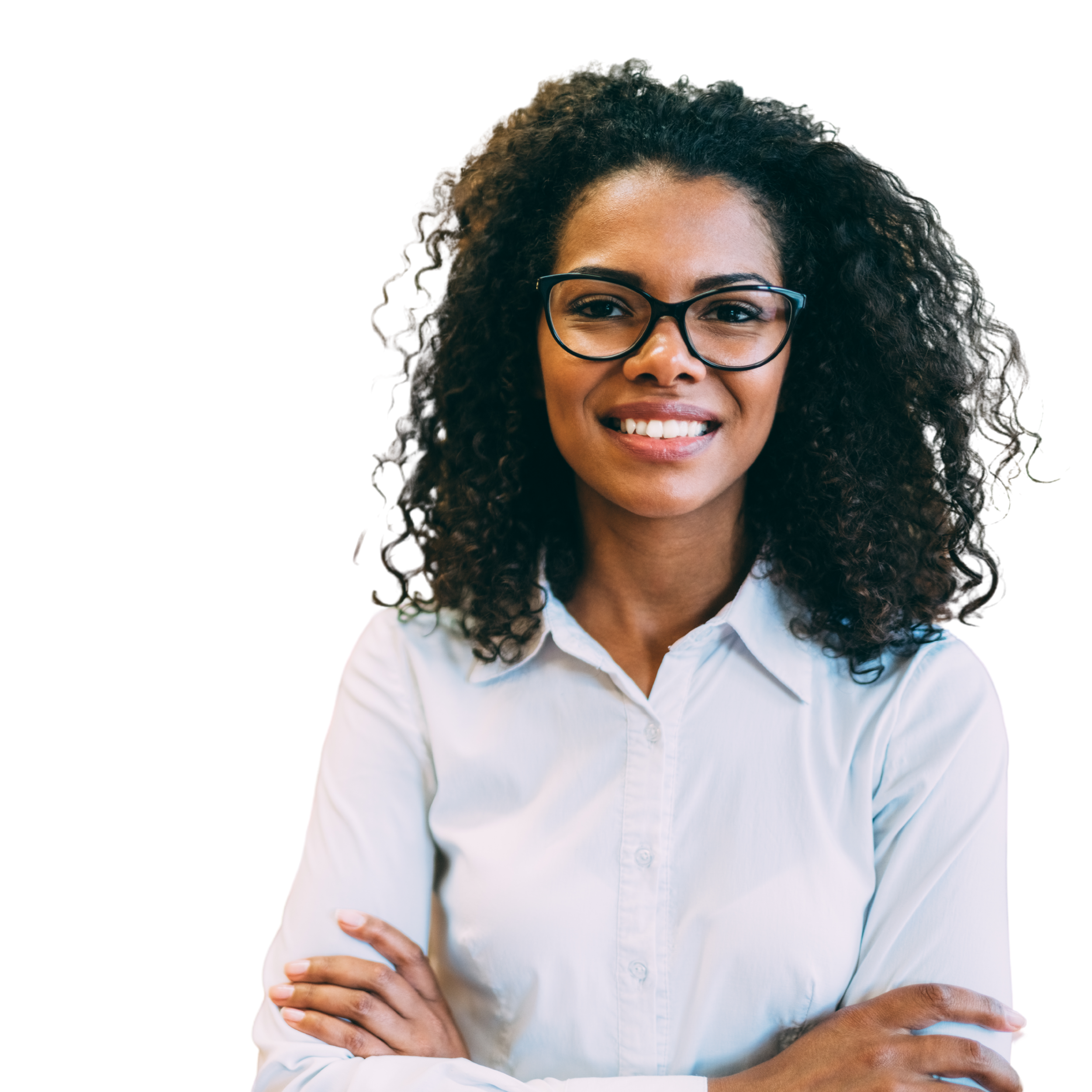 Close-up of a woman with curly black hair, wearing glasses and a white collared shirt, smiling with arms crossed.