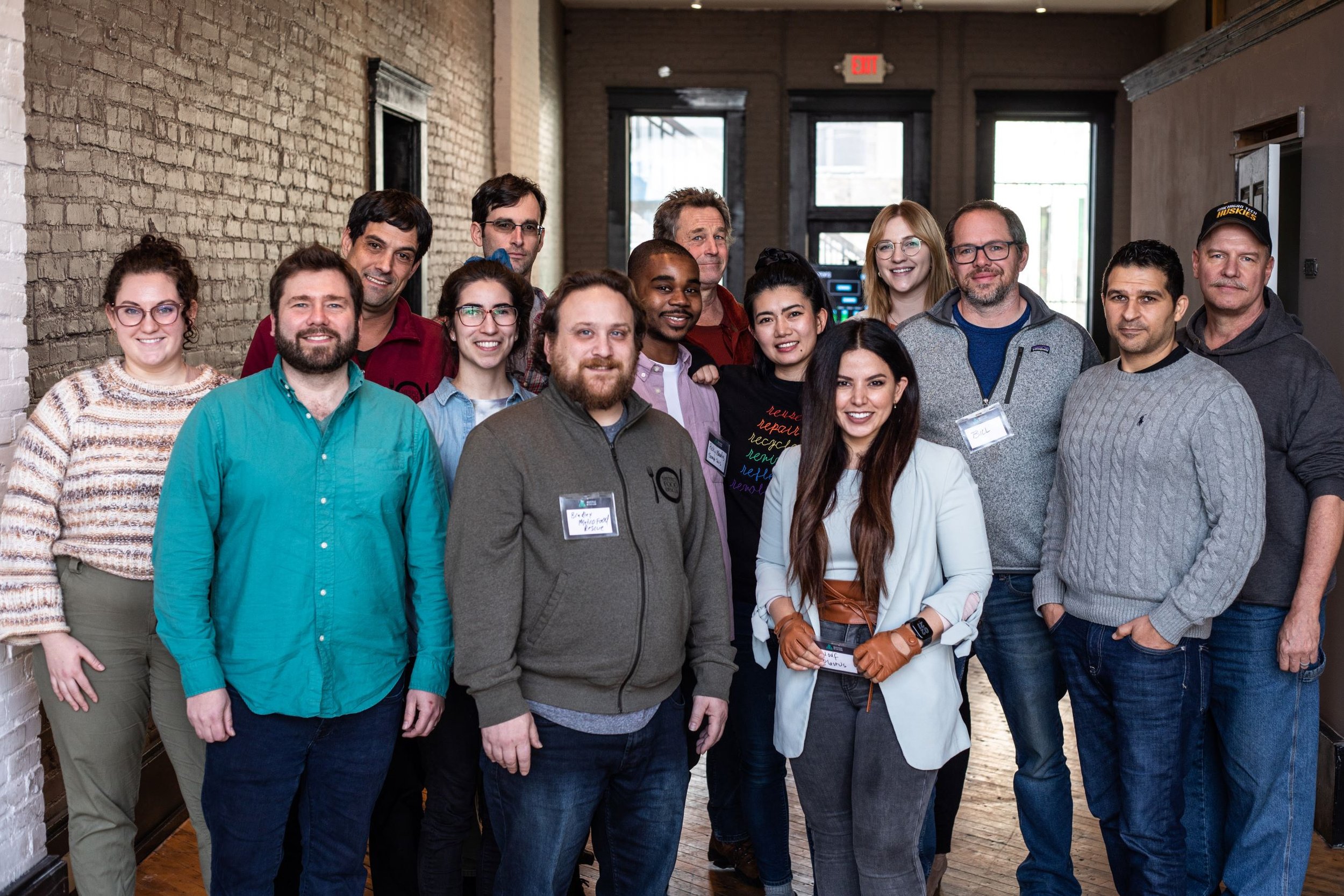 Group photo of multiple NextCycle teams and staff