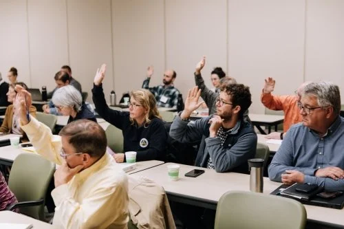 Teams at the accelerate camp participate during an interactive presentation