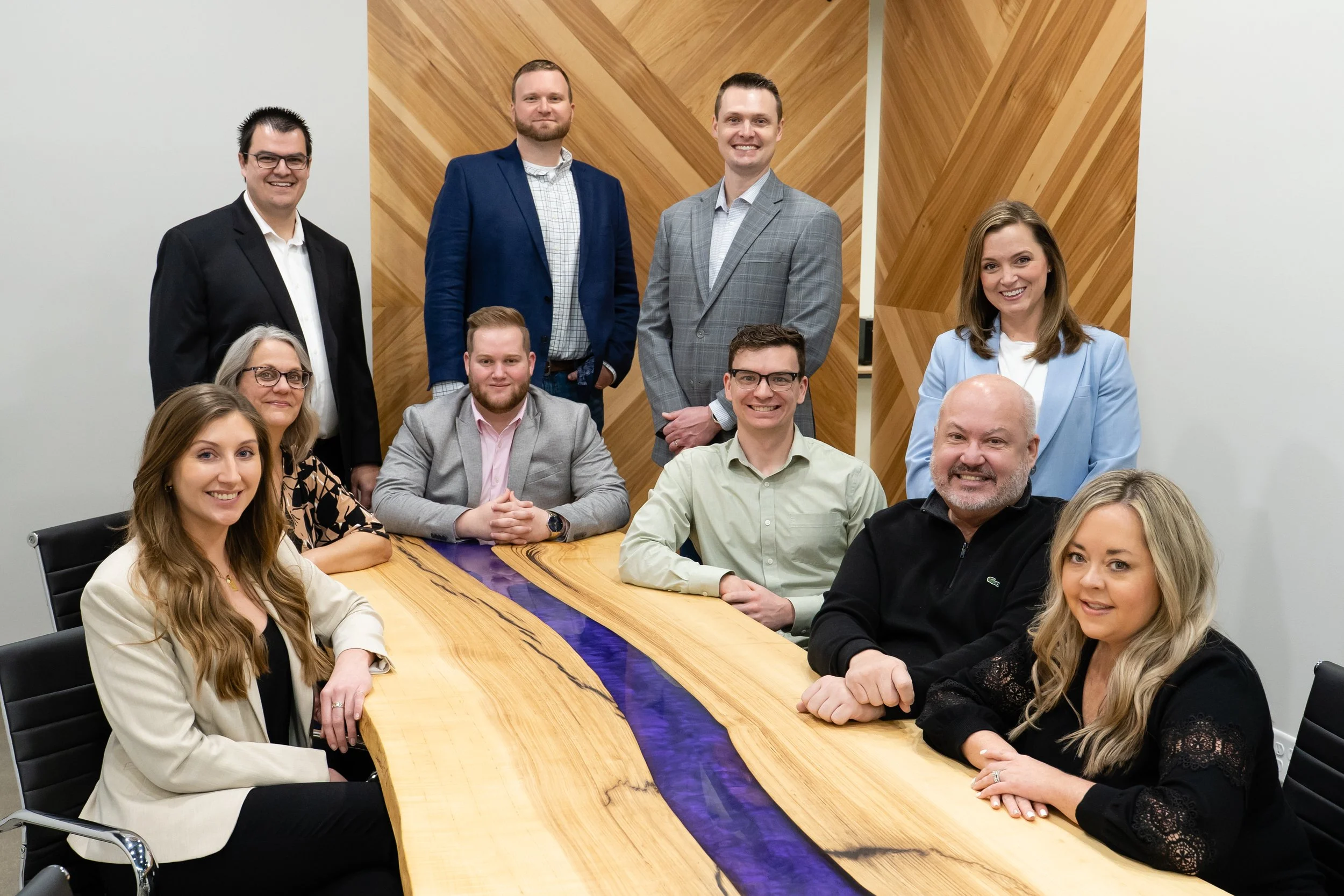 Professional team gathered around a conference table in a modern office