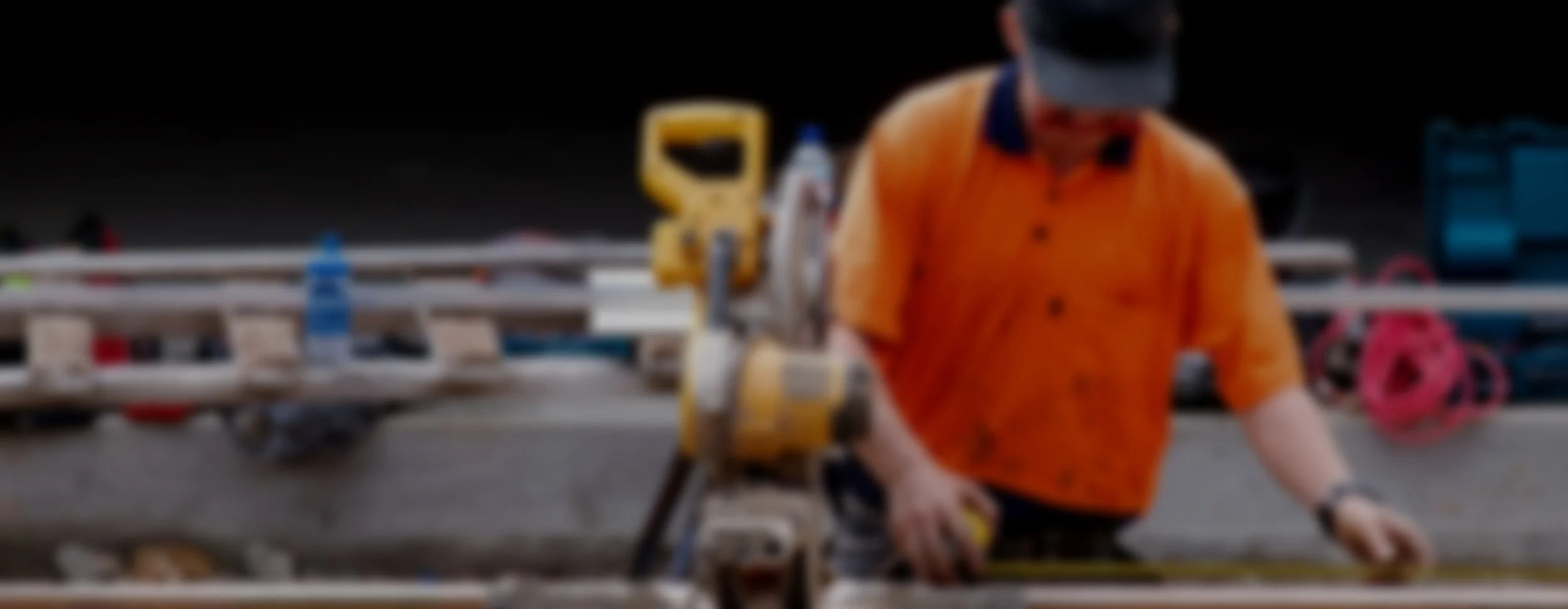 Oranssi carpenter using bench saw