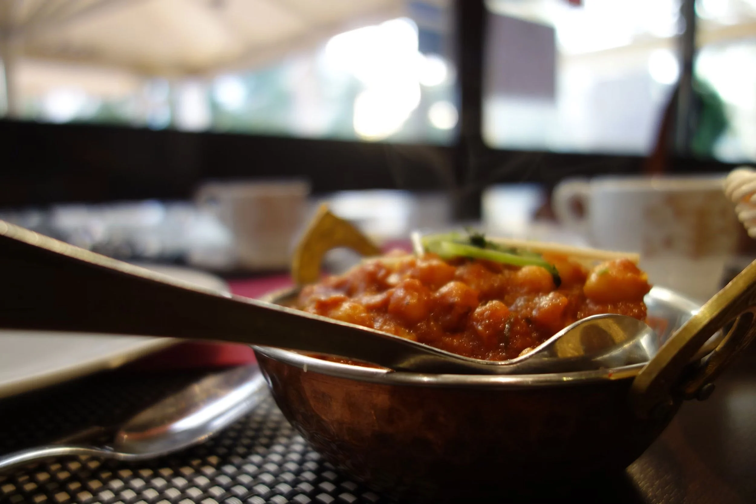 Stainless steel skillet with cooked vegetables